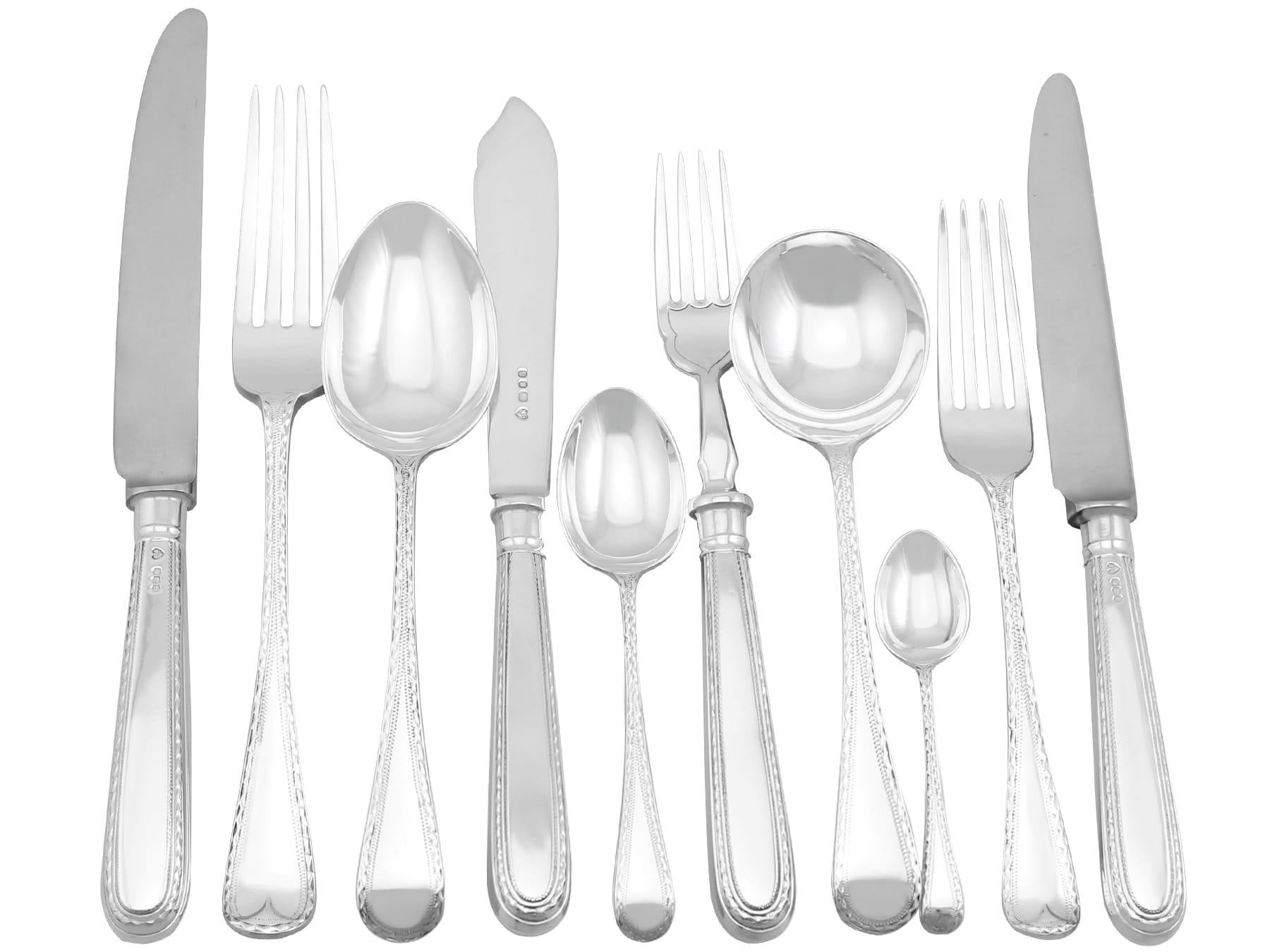 An exceptional, fine and impressive, comprehensive vintage Elizabeth II English sterling silver straight Bright Cut Old English pattern canteen of cutlery for twelve persons; an addition to our silver flatware sets.

The pieces of this exceptional