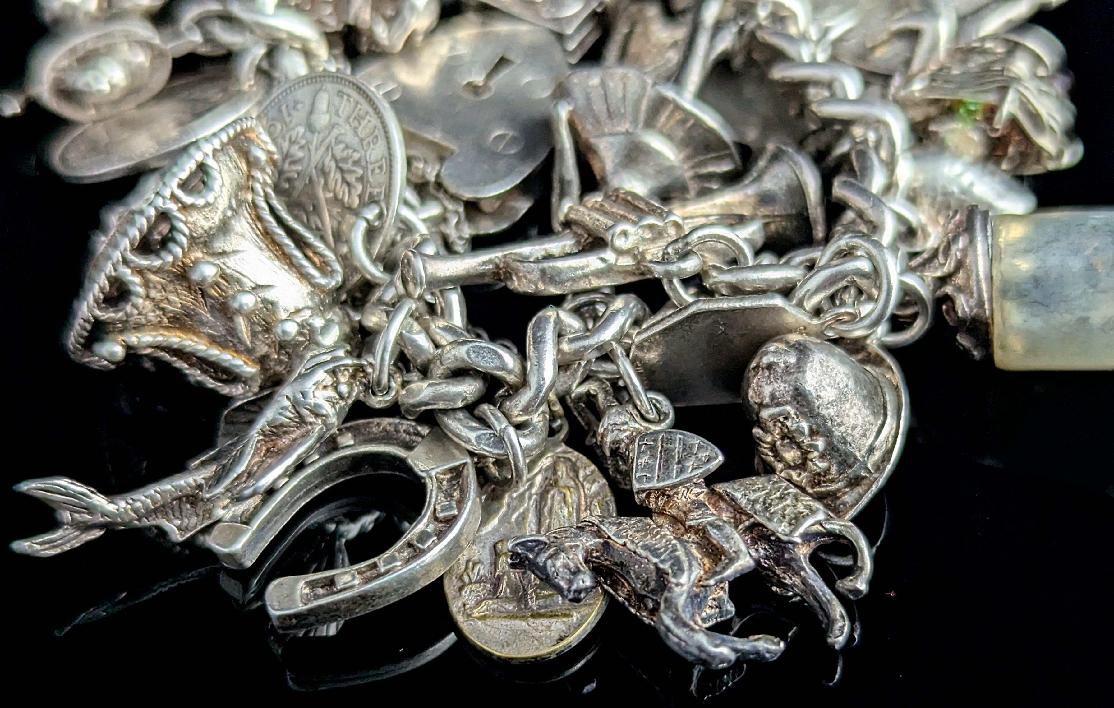 Vintage sterling silver charm bracelet, heavy, loaded 1
