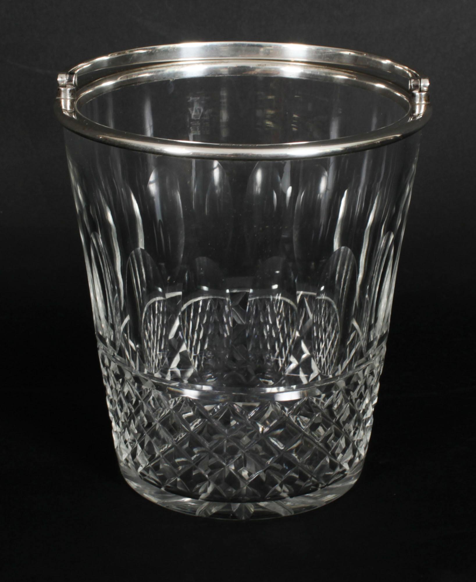 A superb vintage sterling silver mounted hobnail-cut clear cut glass ice bucket with swing handle and star cut base.

The ice bucket fully marked, with hallmarks for Birmingham 1988.

There is no mistaking it's unique quality and design which is