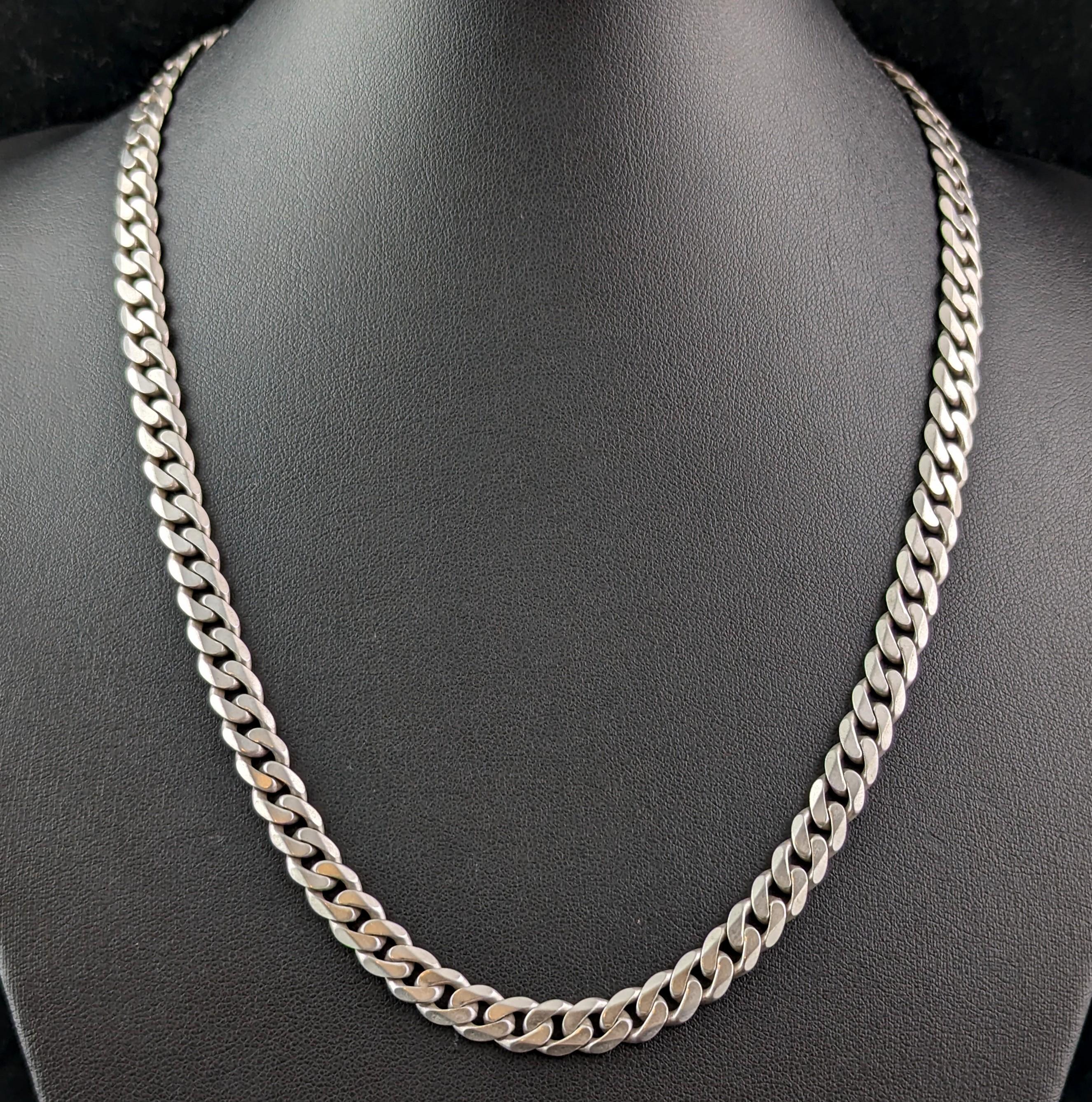A lovely vintage sterling silver flat curb link chain necklace.

Crisp flat curb links really make this chain stand out whilst at the same time making it incredibly easy and comfortable to wear.

It is a great length at 20