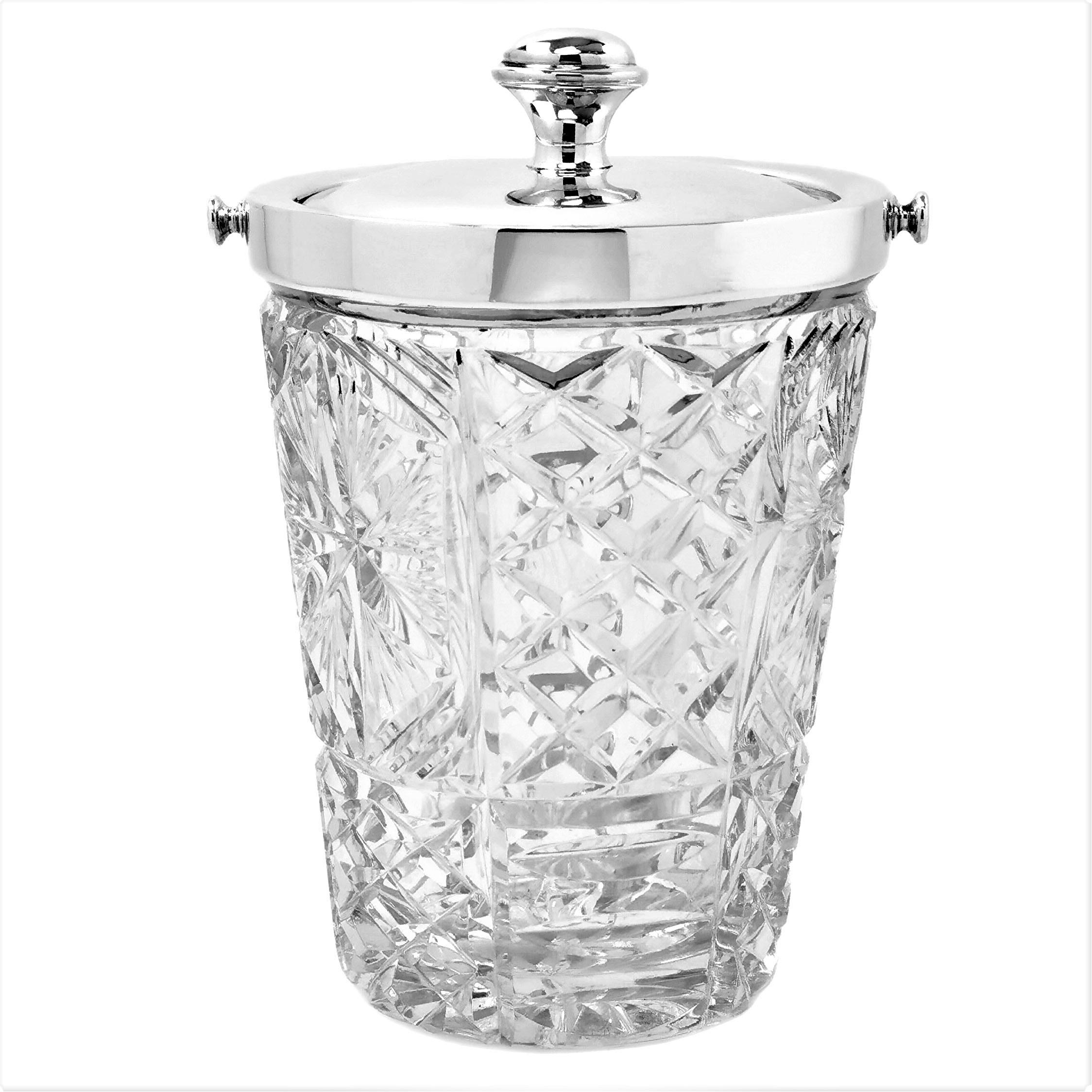 A traditional vintage Ice Bucket with heavy cut glass body and a sterling silver neck and lid. The cut glass body has an elegant pattern on the entire exterior surface with complements the plain polished Sterling Silver.

Made in London, England in