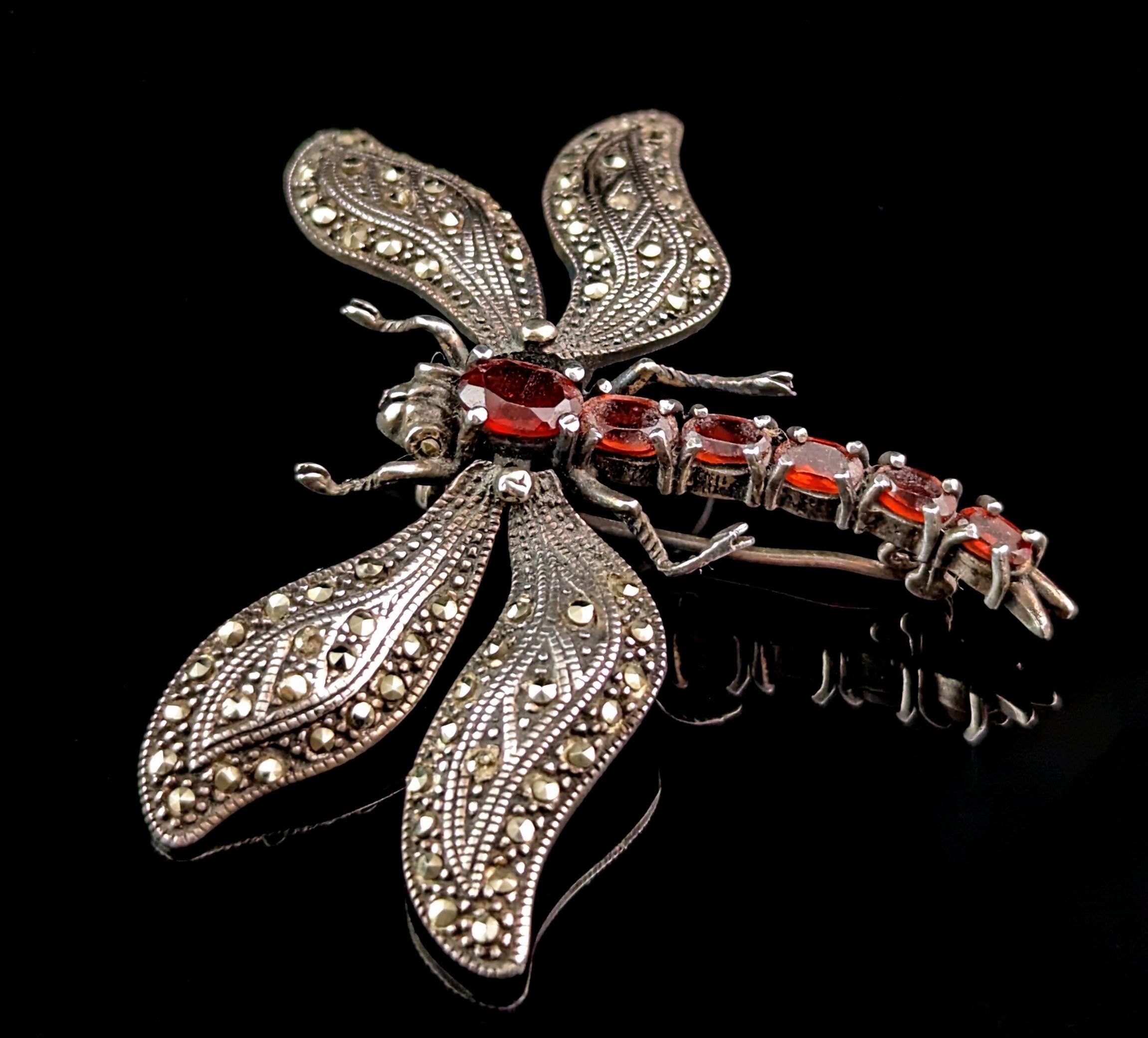 This vintage sterling silver Dragonfly brooch is a truly striking piece.

It is a large sized brooch that could be worn in many ways and the wings are lightly articulated so have some movement.

The wings are adorned all over with marcasite and the