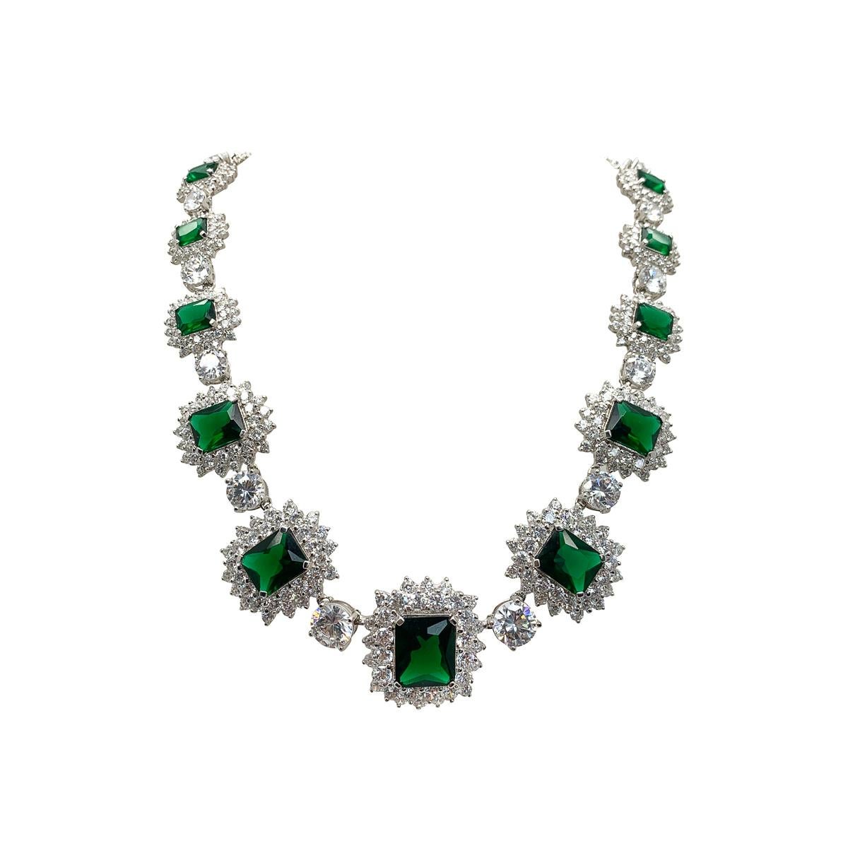A breath-taking suite comprising a vintage emerald crystal necklace, bracelet and ring. Crafted in solid sterling silver with each stone claw set.
Featuring large emerald crystals surrounded by galleries of white. Creating of course a feel of