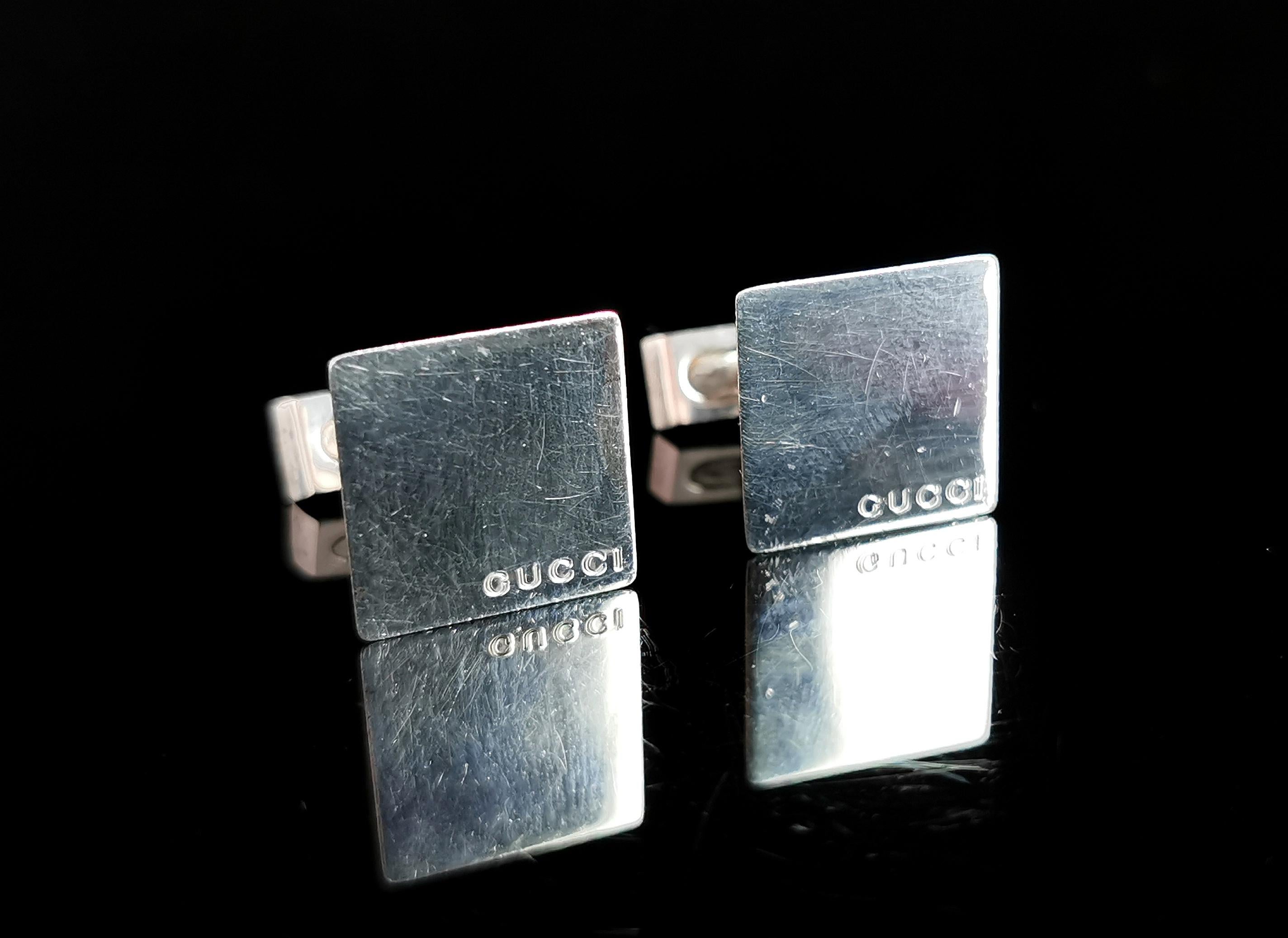 An attractive pair of vintage Gucci sterling silver cufflinks.

Nice chunky cufflinks these are quite heavy with a square face featuring the Gucci brand name engraved to each corner.

They are made from solid sterling silver and are marked 925 for