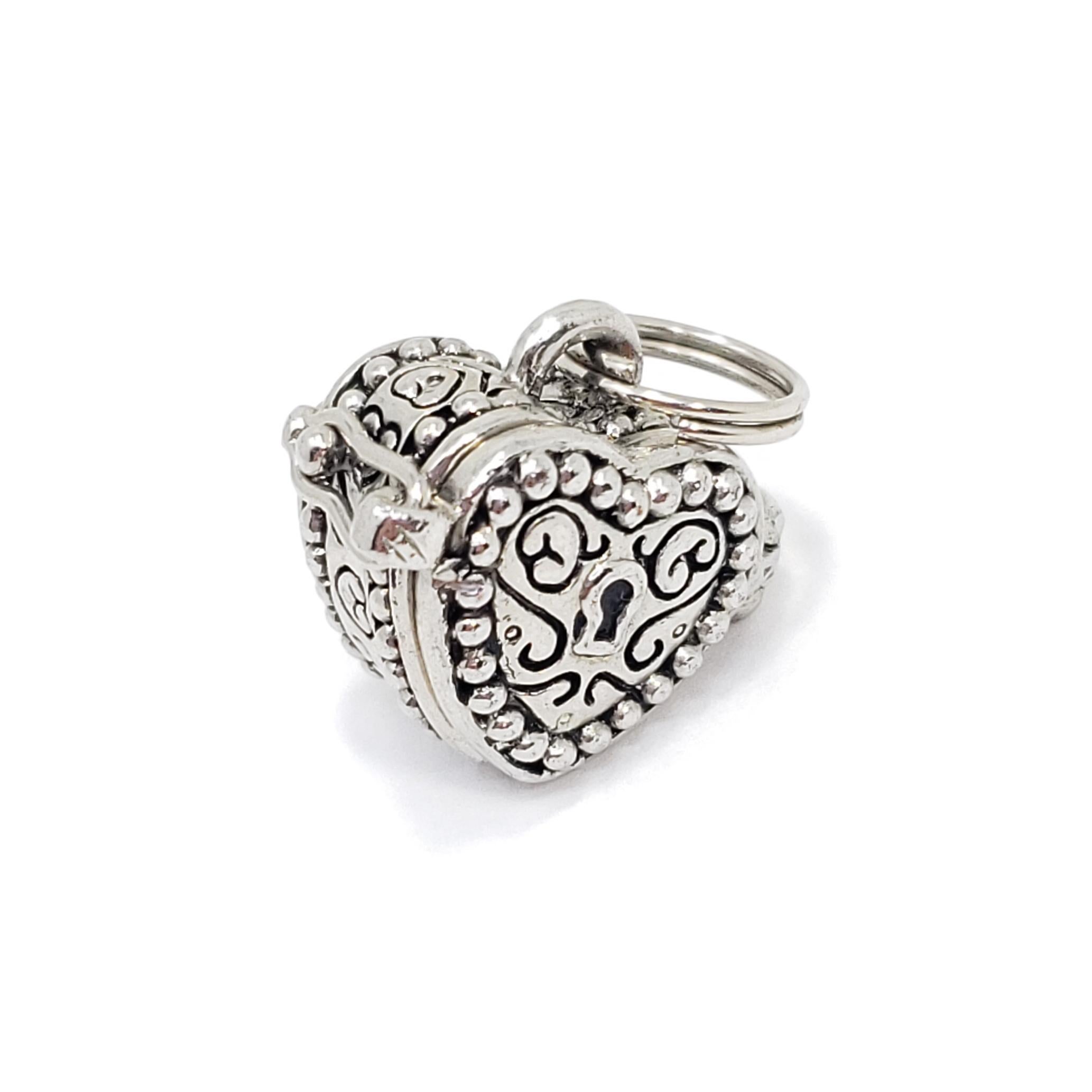 This vintage locket pendant features an accented heart with a keyhole motif, for your most meaningful possessions!

Sterling silver, circa mid 1900s. Snap closure. Comes without chain. 