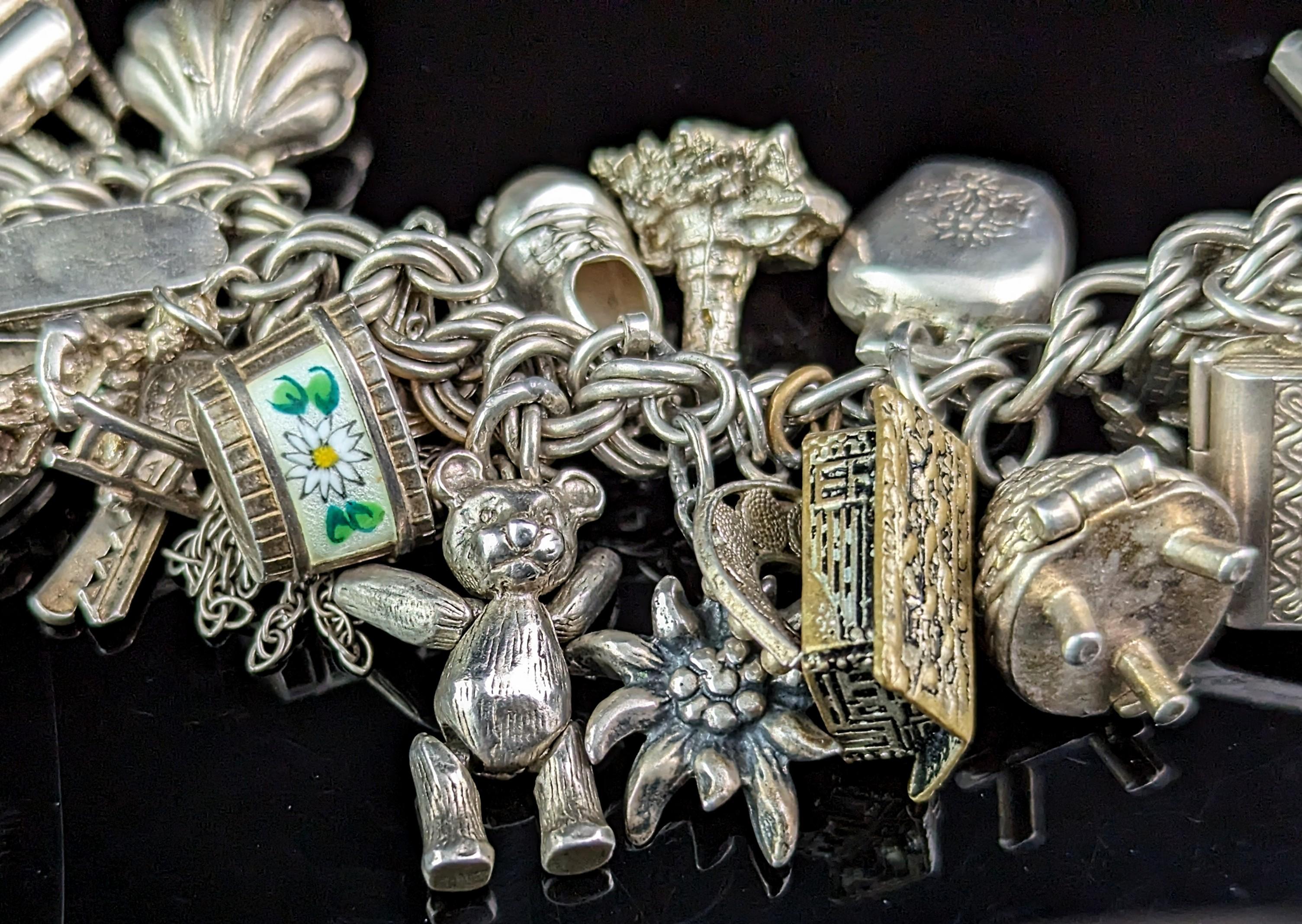 Vintage sterling silver loaded charm bracelet, Heavy, Mid century  In Good Condition For Sale In NEWARK, GB
