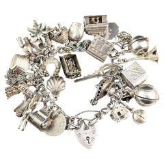 Retro sterling silver loaded charm bracelet, Heavy, Mid century 