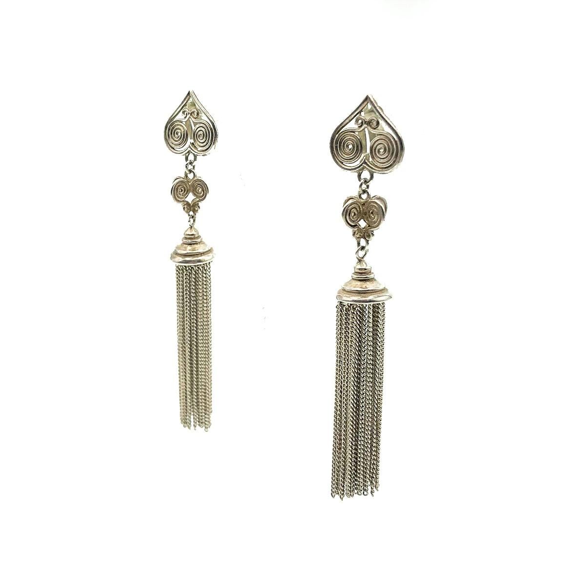 A divine pair of Vintage Silver Tassel Earrings. Crafted in solid sterling silver. A weighty fine chain tassel drops from a heart inspired design top. In very good vintage condition without damage or repair, stamped 'sterling', approx. 9cms.