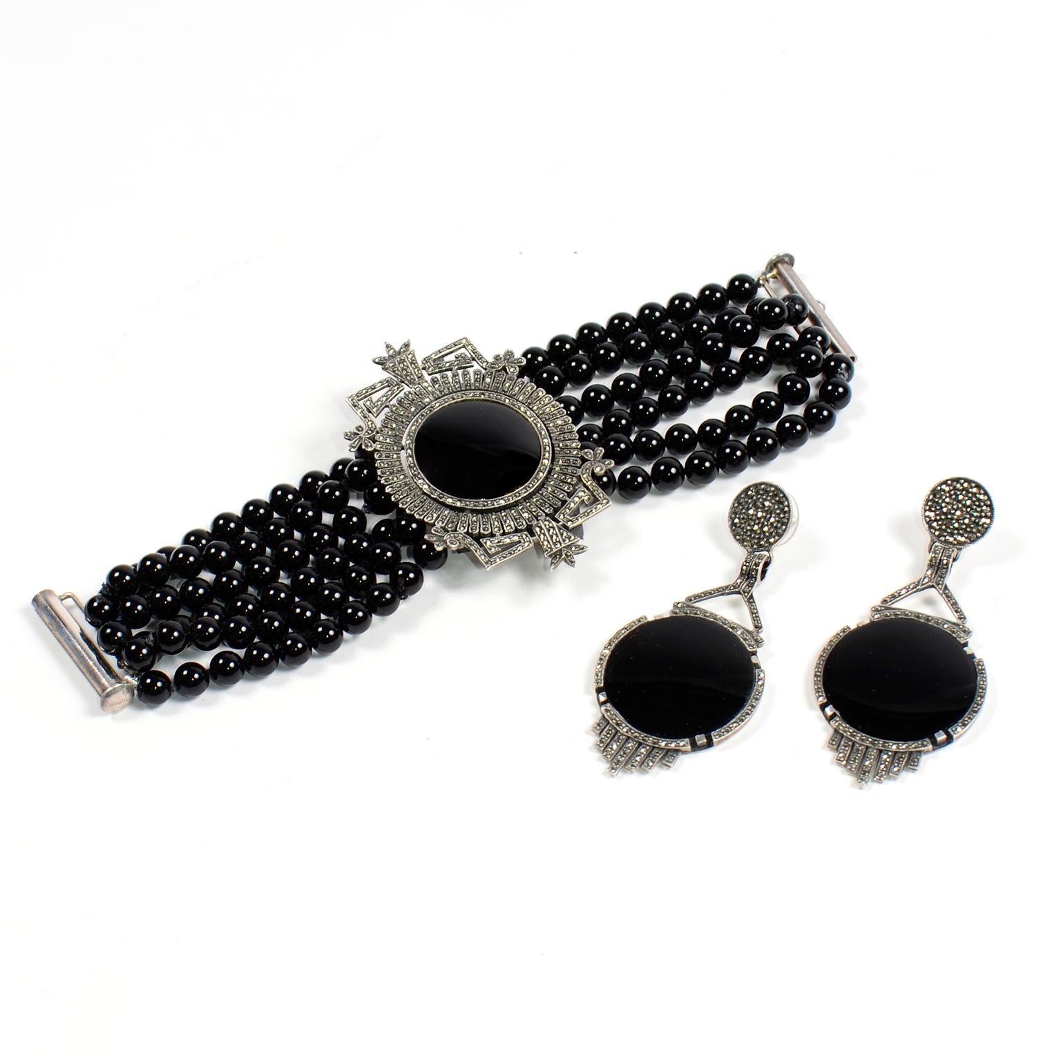 This is an exquisite vintage sterling silver marcasite and onyx bracelet and earring set from the 1980's.  This gorgeous set came from an estate we acquired that had outstanding vintage jewelry and clothing from the 1970's and 1980's. This  includes