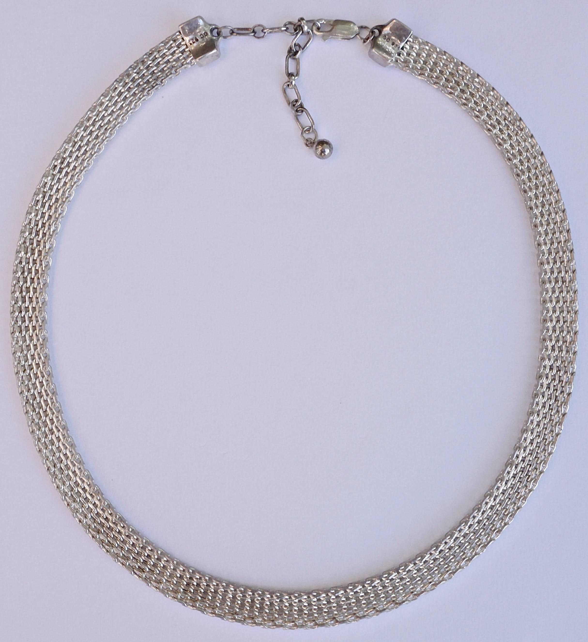Lovely polished sterling silver mesh necklace, stamped GC 925. Width 8mm, .31 inch, and length 41cm, 16.1 inches, plus the extension chain of 5cm, 1.9 inches, total length 46cm, 18 inches.

In excellent condition, this is a classic vintage silver