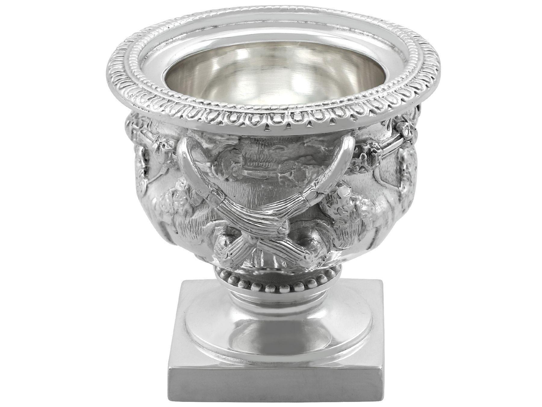 An exceptional, fine and impressive vintage 1980s English sterling silver miniature Warwick vase; an addition to our silver presentation collection.

This exceptional vintage miniature silver Warwick vase, in sterling standard, has a Campania shaped
