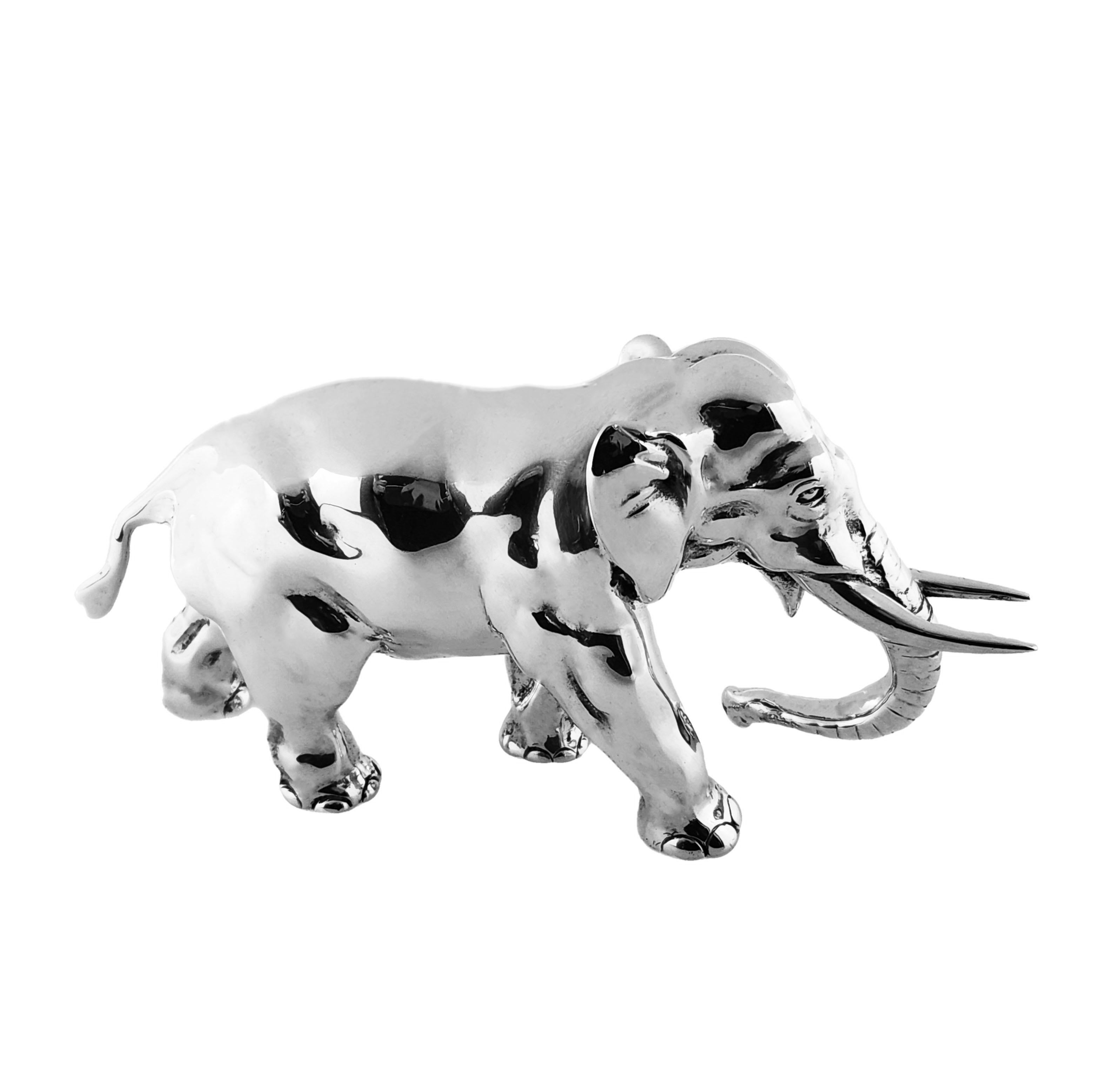 A beautiful Solid Silver Model of an Elephant of exceptionally heavy weight. A carefully crafted model with a great attention to detail, this Model Elephant of of a notably heavy weight and size suitable for use as a paperweight. The Elephant has a