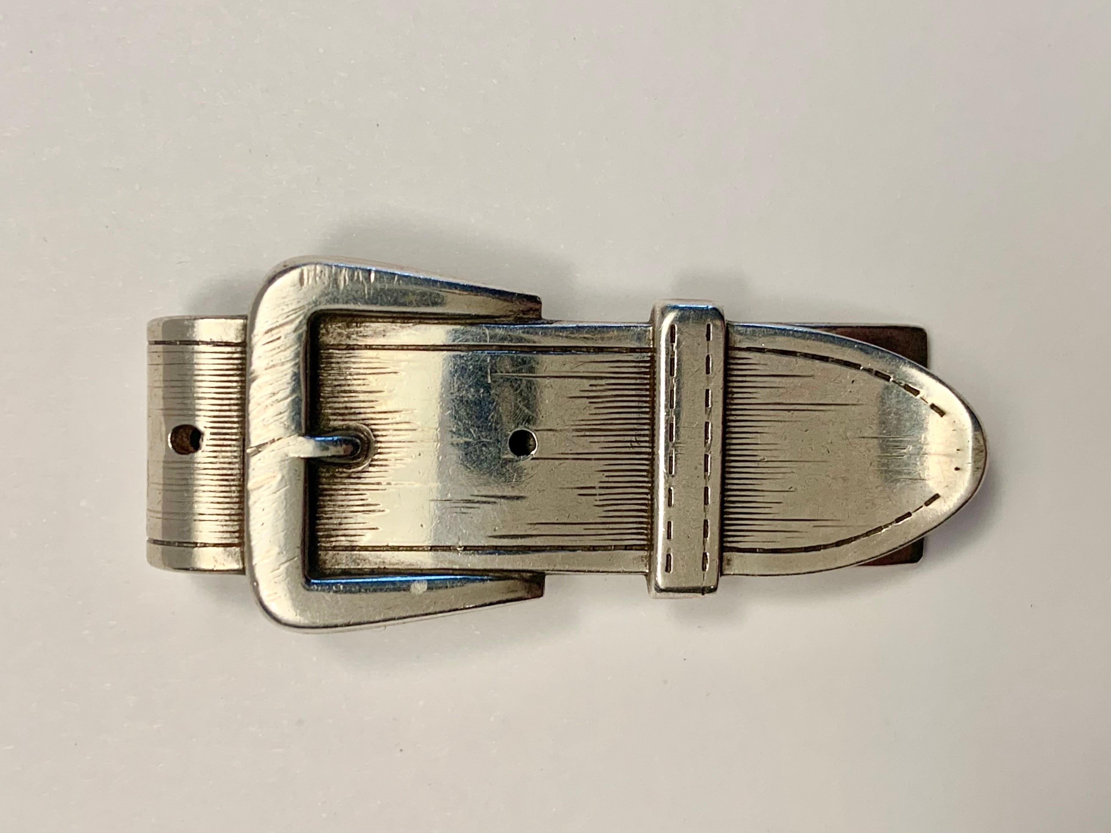 This mid Century sterling silver money clip is a nice alternative to a billfold.  it is designed to look like a belt and buckle, complete with a 