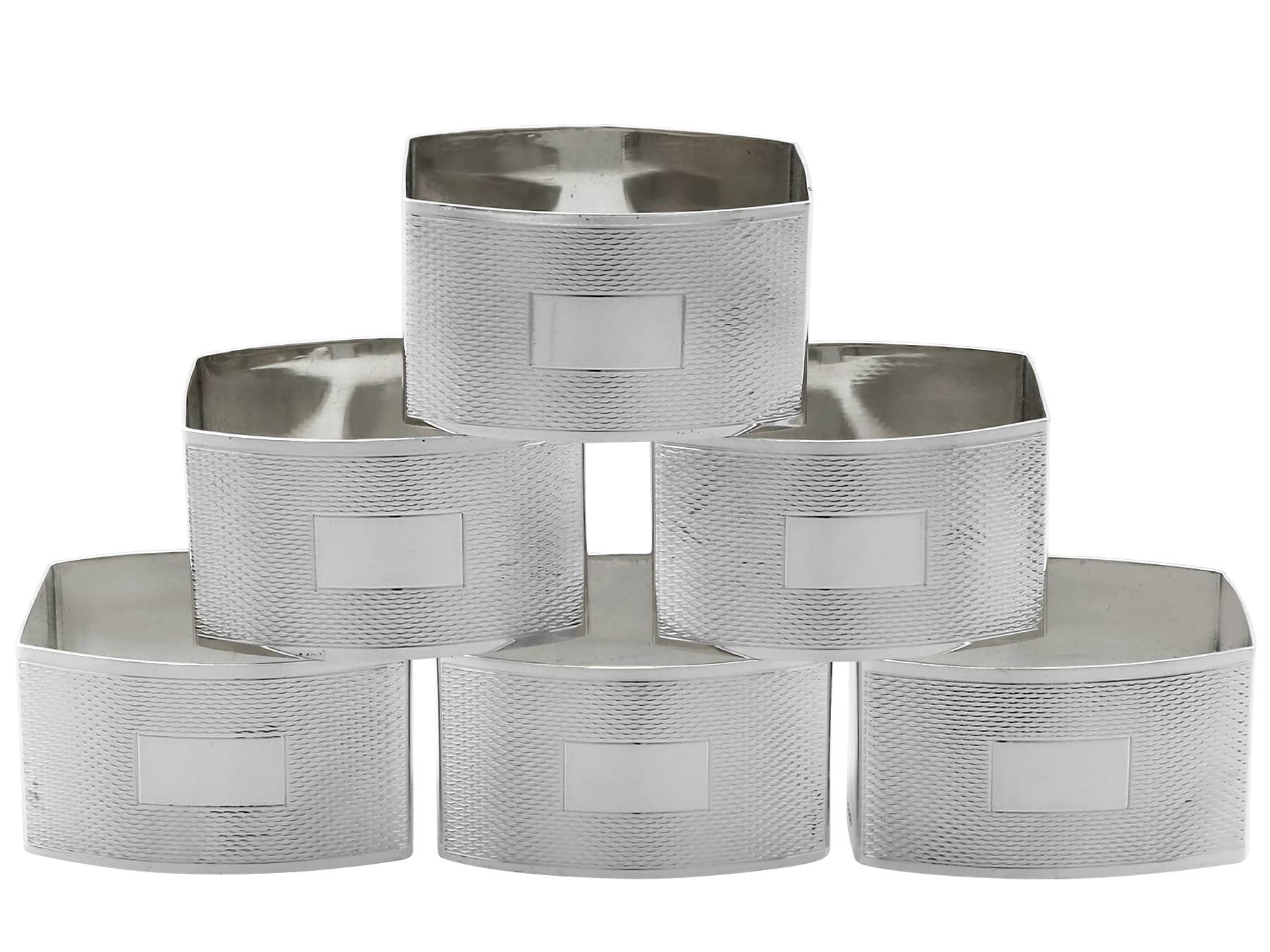 An exceptional, fine and impressive set of six vintage Elizabeth II English sterling silver napkin rings - boxed; part of our dining silverware collection

These exceptional vintage English sterling silver napkin rings have a rectangular rounded