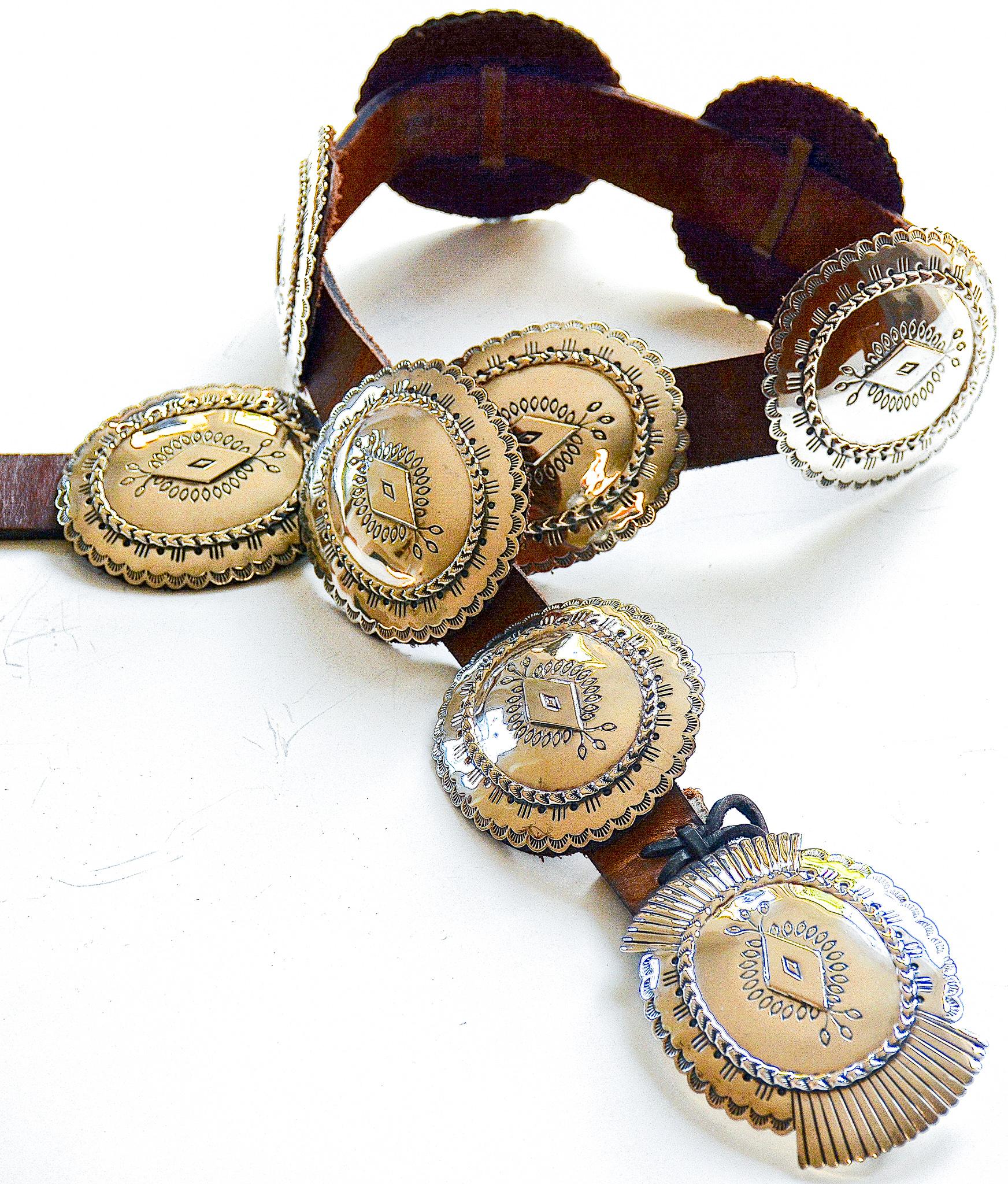
A beautiful vintage sterling silver Navajo concho belt by renown Navajo silversmith Bruce Morgan. This belt contains 8 conchos, not including the buckle.  

Signed and stamped 