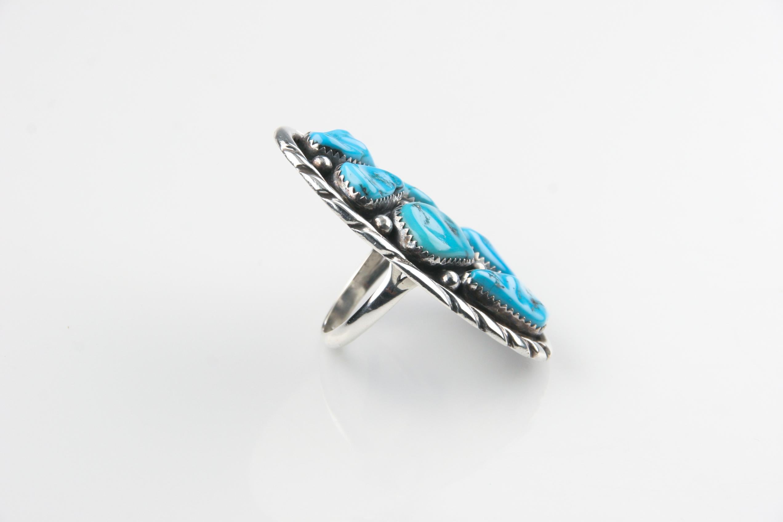 This is a fantastic vintage turquoise and sterling silver Navajo ring that is in great condition and HUGE!
Size: 8 3/4
Measurements: 2 1/4