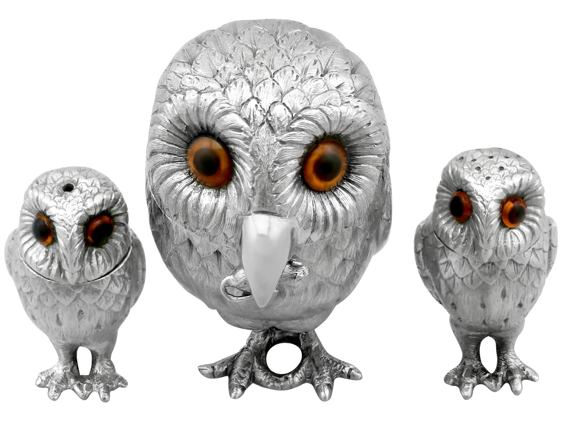 An exceptional, fine and impressive vintage Elizabeth II English sterling silver three piece owl condiment set; part of our 1970s silver dining silverware

This impressive vintage cast sterling silver three piece condiment set consists of a salt