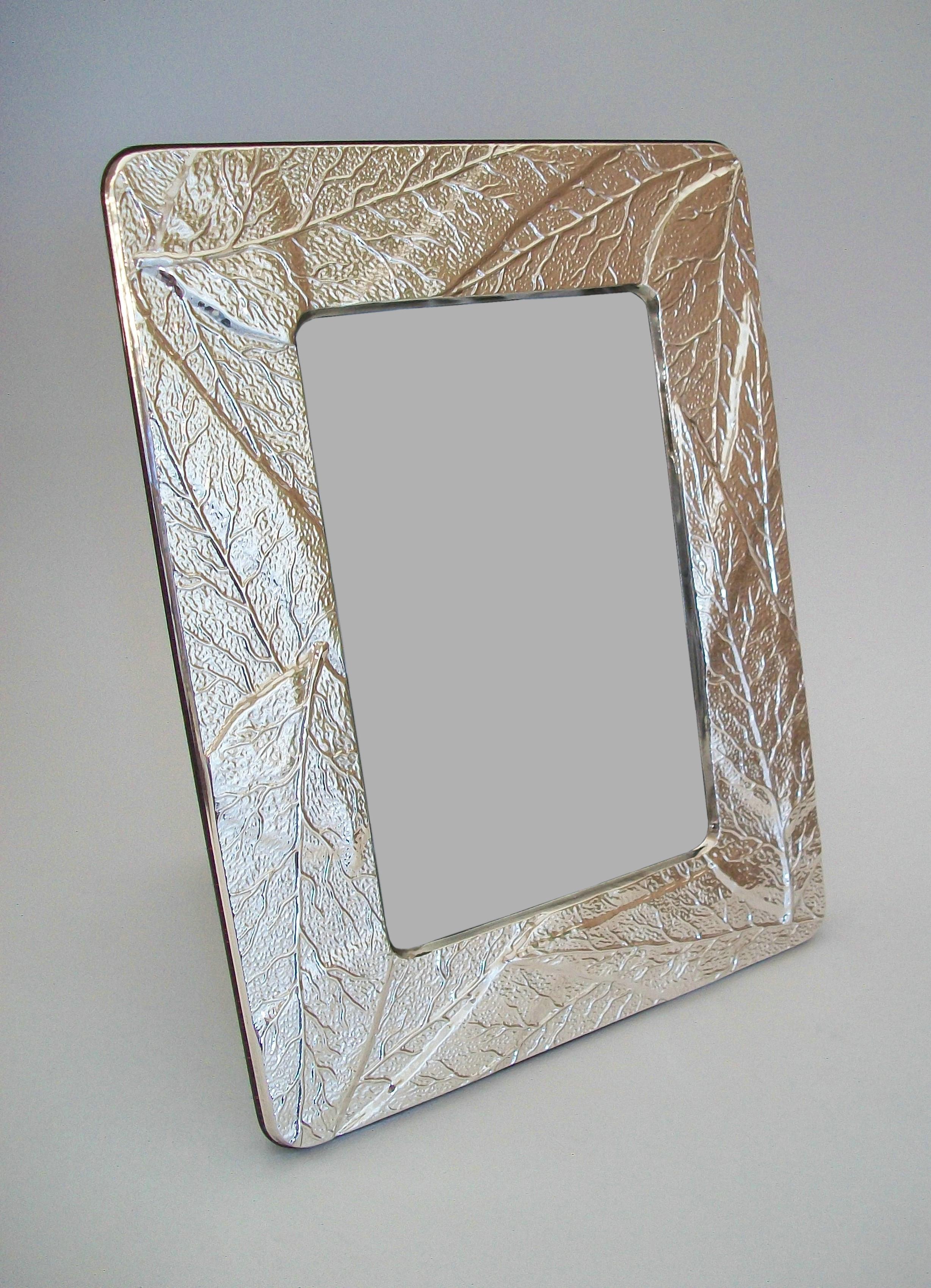 Vintage sterling silver photo frame with embossed leaf pattern - inset glass liner - wood veneered back and easel with high polished / gloss finish - original paper liner with maker's logo (unknown / unidentified) - sterling silver hallmarks to the