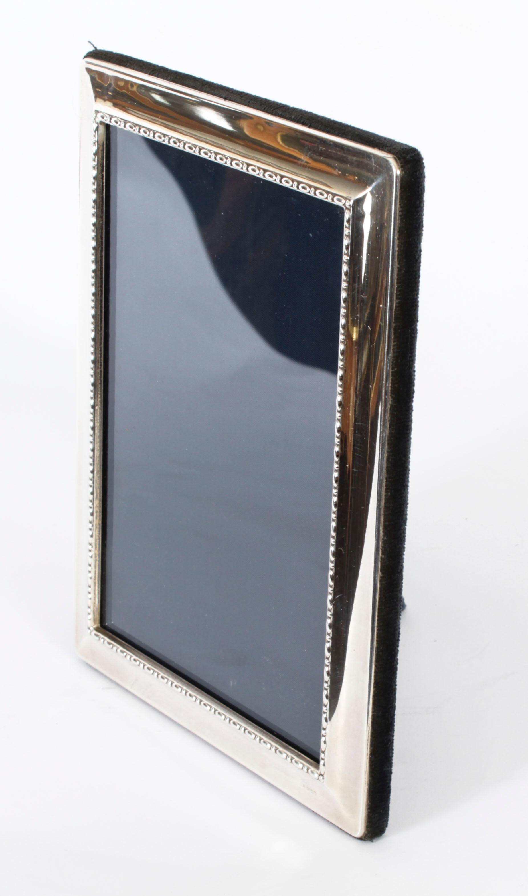 A truly superb petite decorative sterling silver photo frame with makers mark mark RC for Carrs of Sheffield, and halmarks for Sheffield 1995.

This frame can be used portrait or landscape.
 
An excellent gift idea for many occasions or an