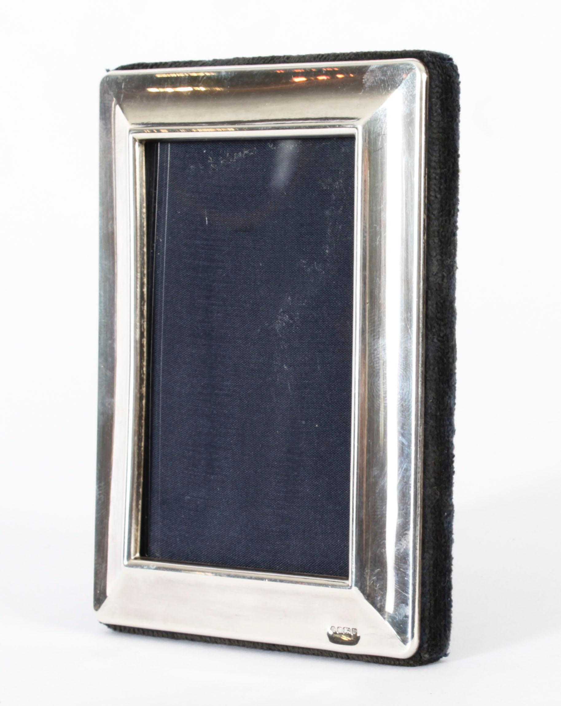 A superb decorative sterling silver photo frame by Carrs of Sheffield, with makers mark RC and hall marks for Sheffield 1996.
 
Beautiful portrait or landscape frame decorated with plain shaped borders. 
 
An excellent gift idea for many