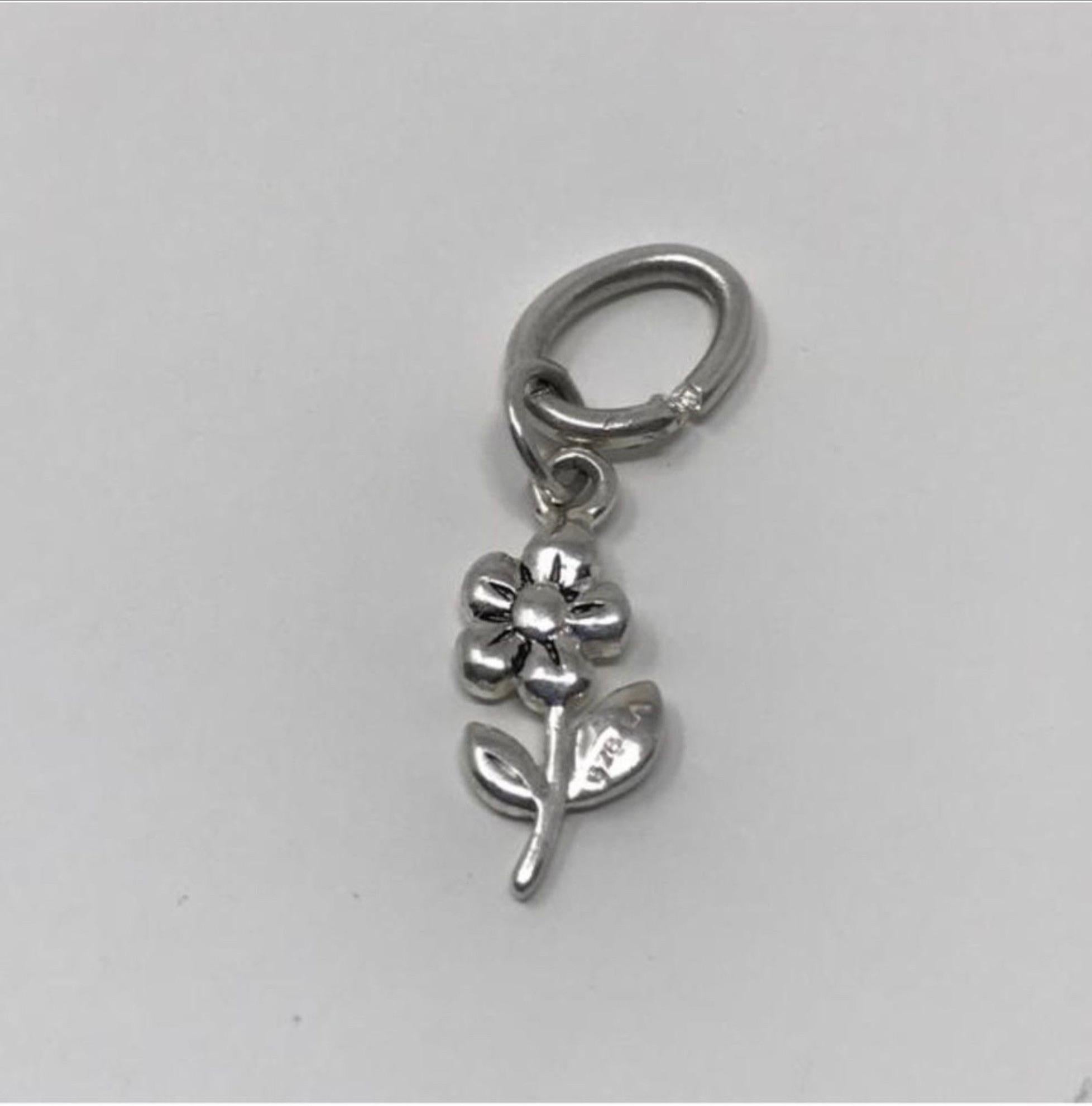 Model - Vintage Sterling Silver Puffy Flower Charm/Pendant

Condition - Exceptional

SKU - 1044-11

Original Retail - $25.00

Dimensions - .75 x .25 x .2

Closure Type - Not Applicable

Material - Sterling Silver

Comes with - No Additional