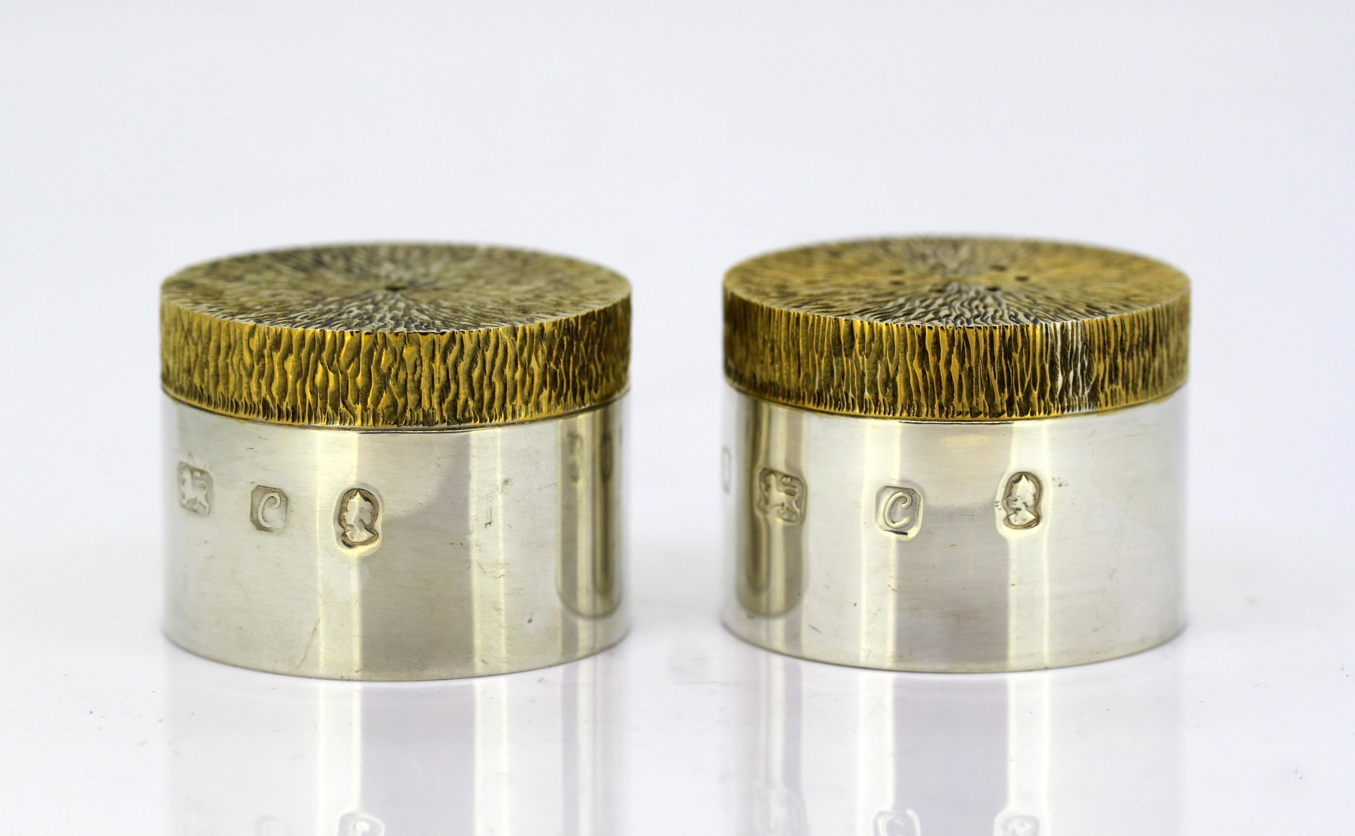 Vintage sterling silver salt and pepper shakers
Maker: JH (Unidentified)
Made in London 1977
Fully hallmarked.

Dimensions - 
Diameter x height: 4.5 x 3.3 cm
Weight: 110 grams total

Condition: Shakers are pre-owned, have surface wear and