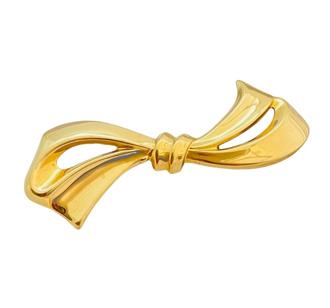 DETAILS
signed STERLING SB
sterling silver gold plated
designer bow pin brooch

MEASUREMENTS
3.88