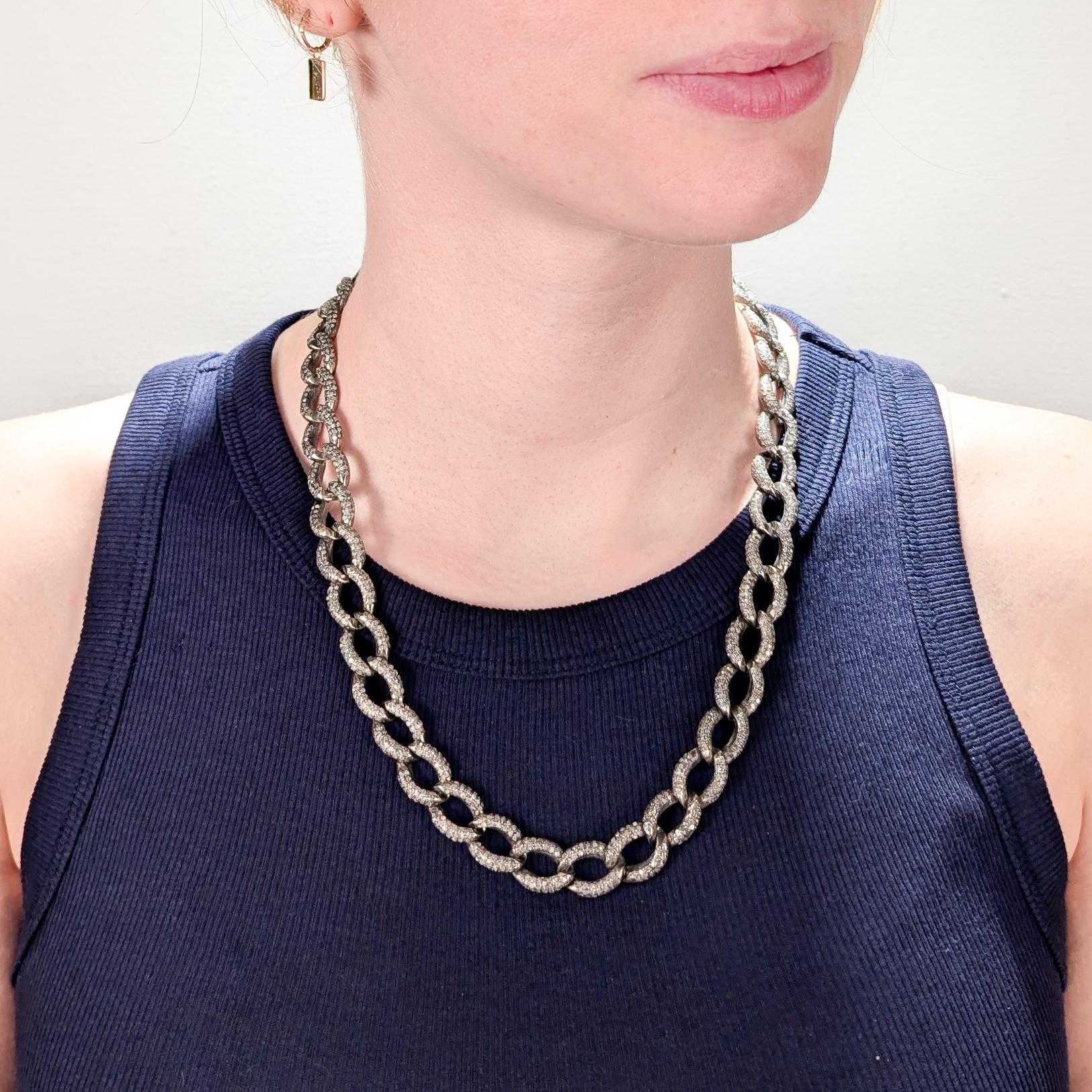A fine silver curb link necklace.

Each link flush set with 40+ single cut white diamonds (with a total of more that 1,750 diamonds).

Secured with a diamond set link clasp with an snap closure for extra security. 

Simply a wonderful silver and