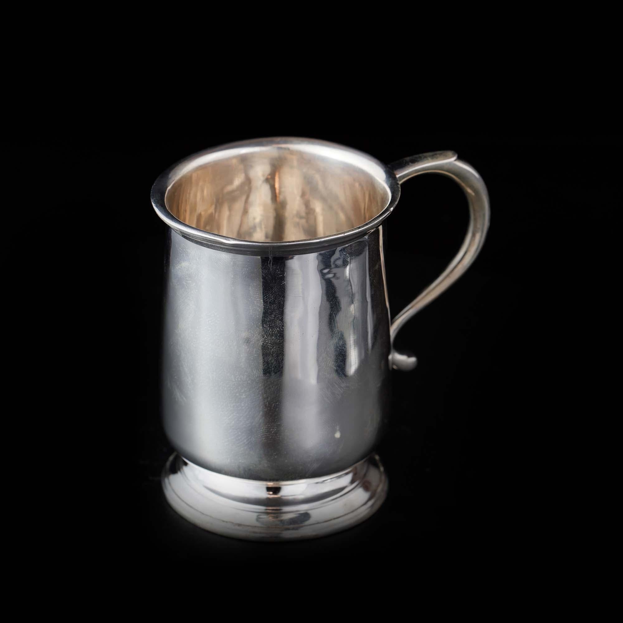 Vintage Sterling silver small mug. 
Maker: James Dixon & Sons Ltd
Made in Birmingham, 1925
Fully hallmarked.

Dimensions - 
Length x width x height: 9 x 6.5 x 8.7 cm 
Weight : 115 grams

Condition : General wear and tear, good condition