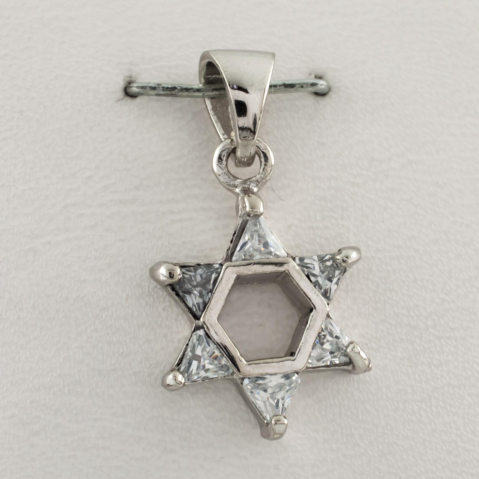 Gorgeous Star of David pendant.
Includes prong-set crystal accents.
Length: 28 mm.
Metal: 0.925 sterling silver.
Weight: 1.8 grams.