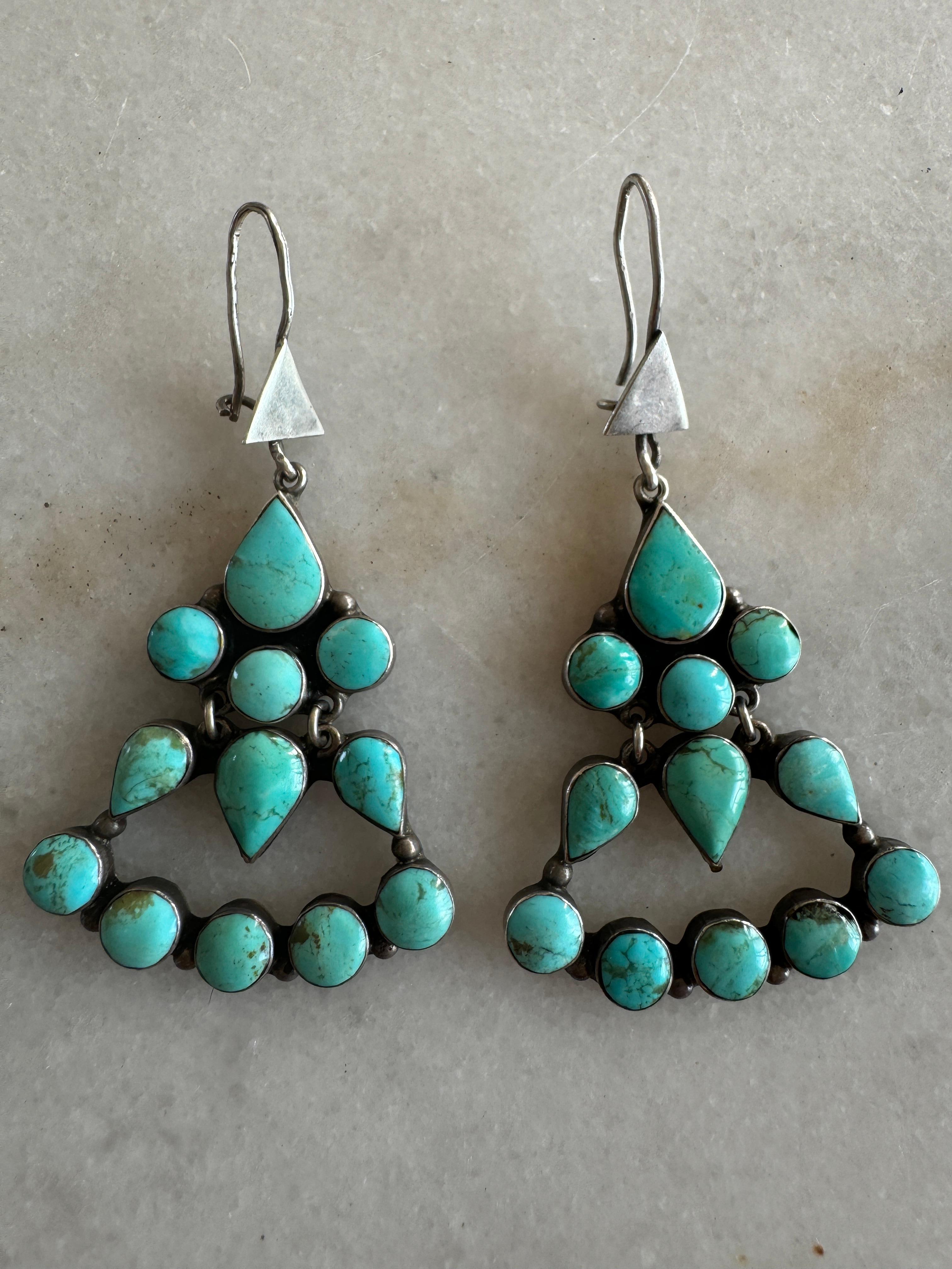 Sterling Silver Drop Earrings, decorated with 16 bezel set round turquoise cabochons, weighing a total of approx. 24.0 carats, further decorated with 8 bezel set pear turquoise cabochons, weighing a total of approx. 20.0 carats, combined total