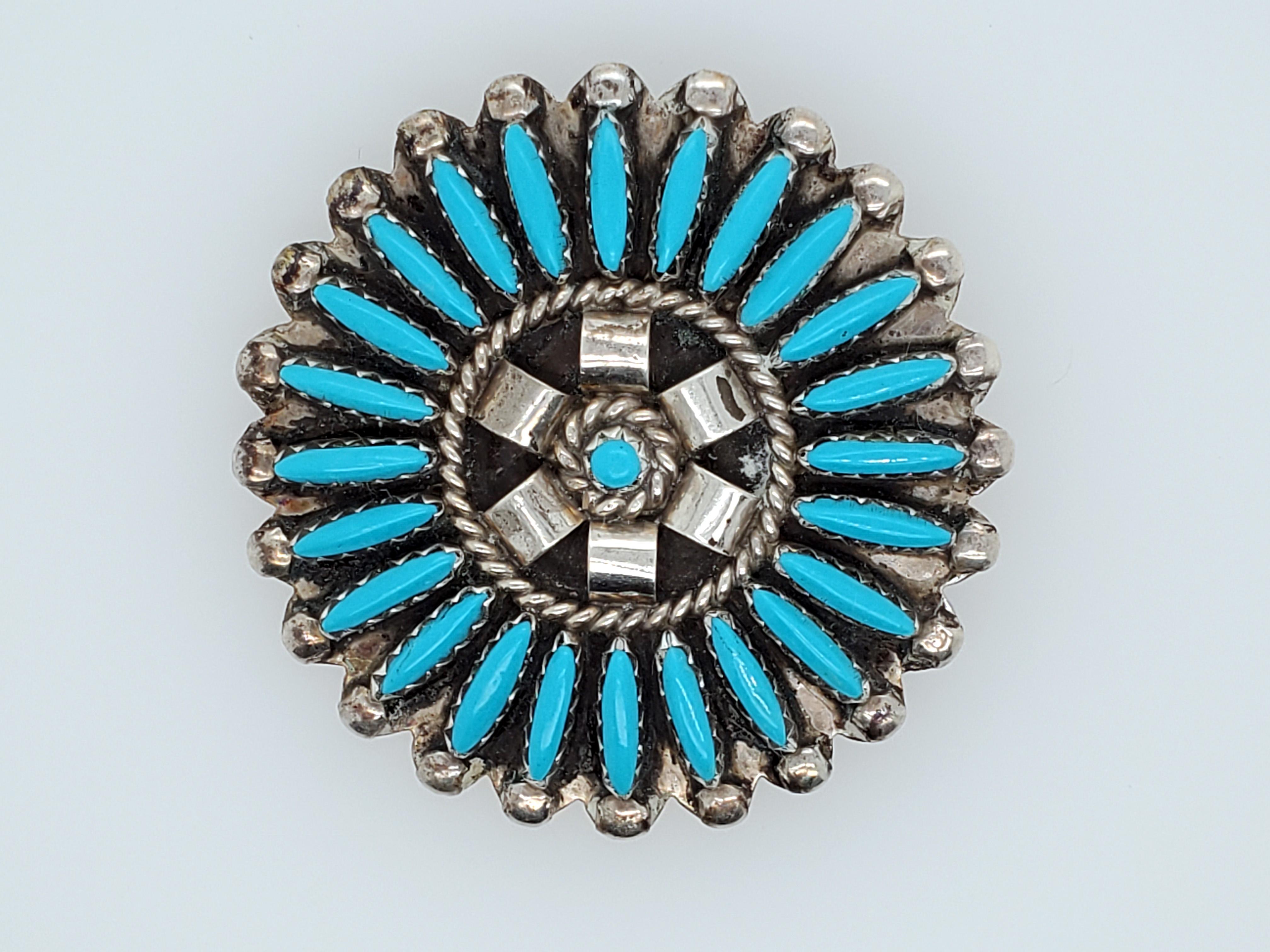 Sterling Silver with Turquoise, Zuni hand-made pin, signed by the maker - CJ. (Beautiful Vintage Needle Point Cluster, believed to be by Charlie John, well known Navajo Artist) Measures about 2 inches across. A wonderful piece found in our vaults