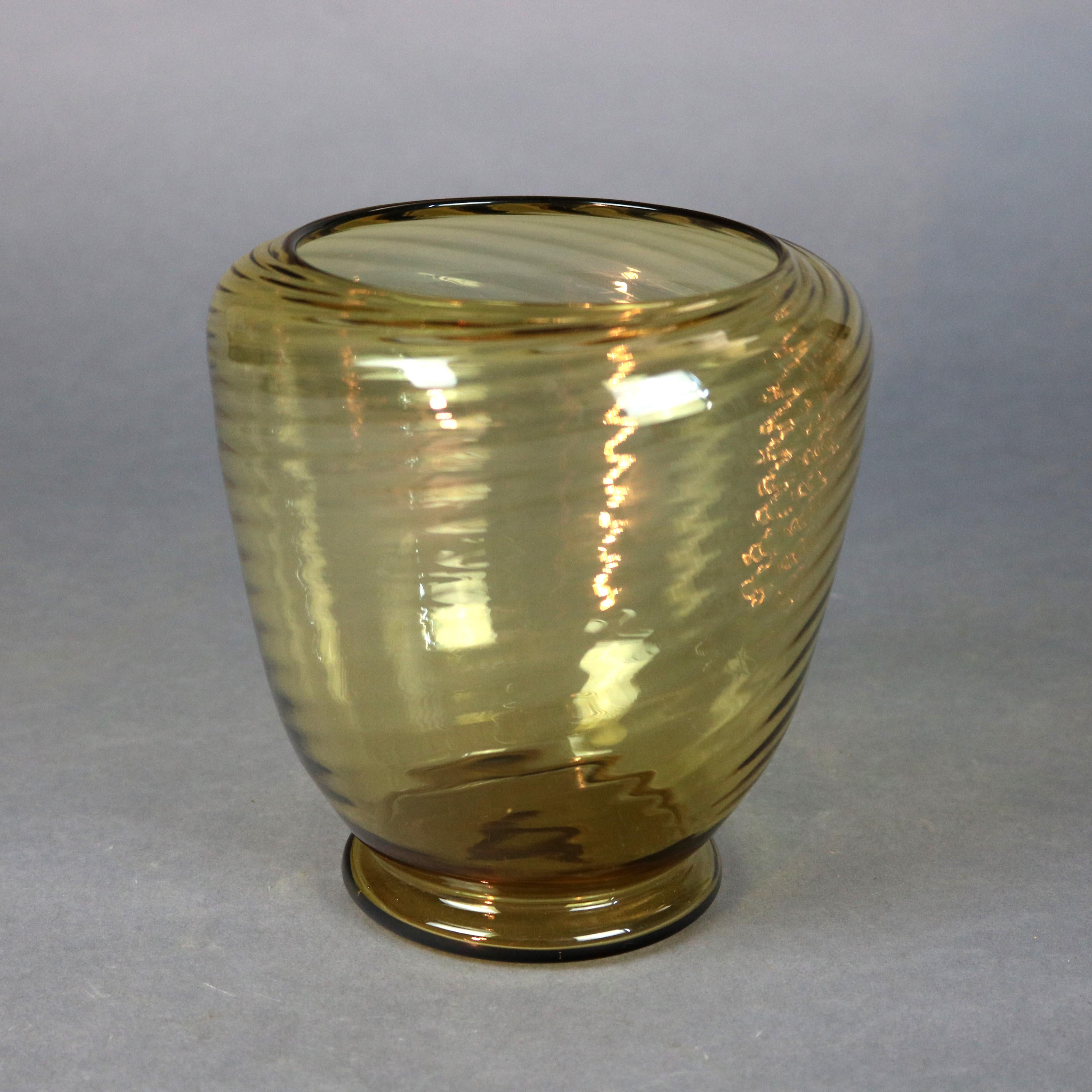 A vintage art glass vase by Steuben offers swirled amber glass, unsigned, 20th century

Measures: 6.75