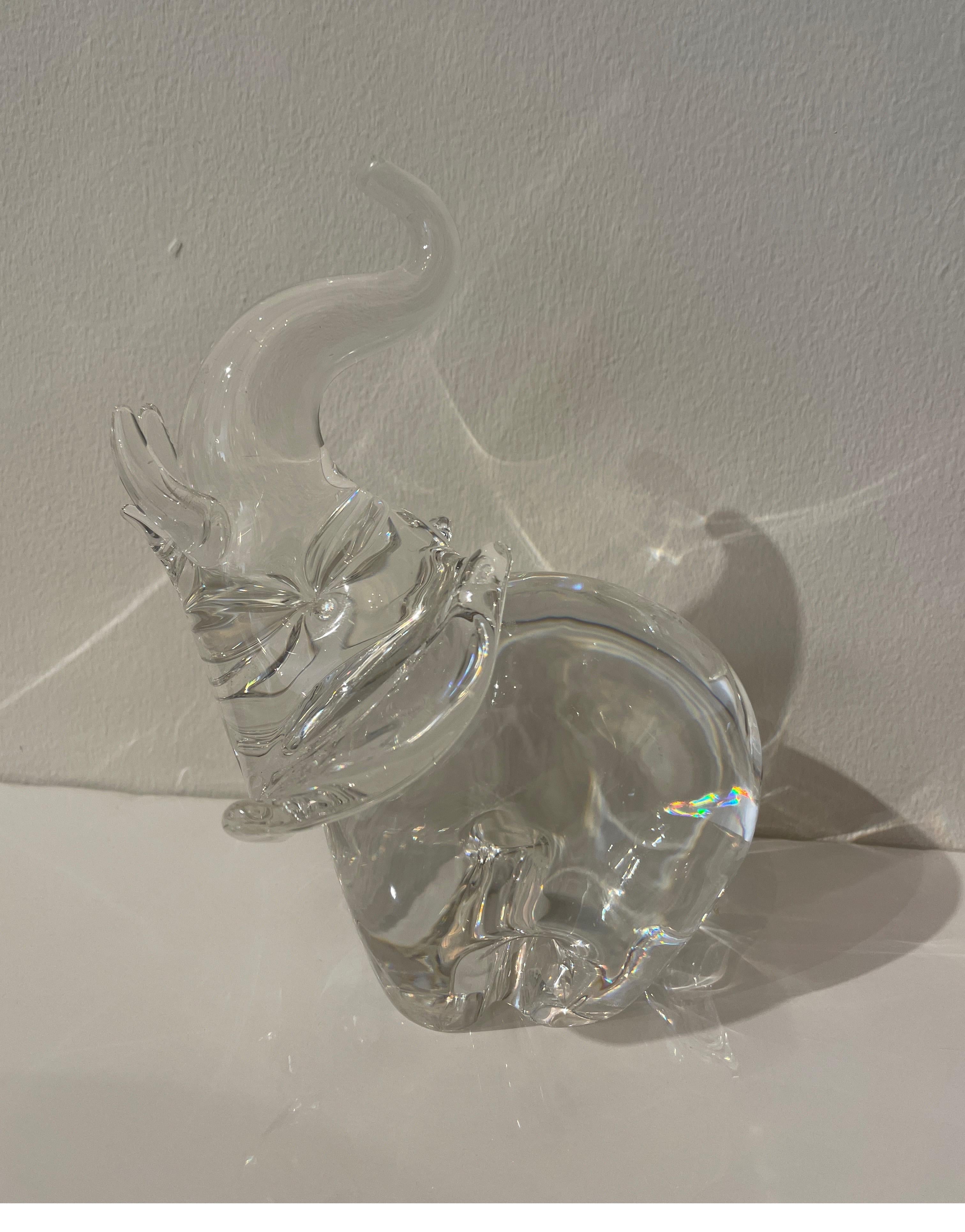 Vintage Steuben glass elephant sculpture with an upward trunk. This good luck piece is a welcome addition to any collection.