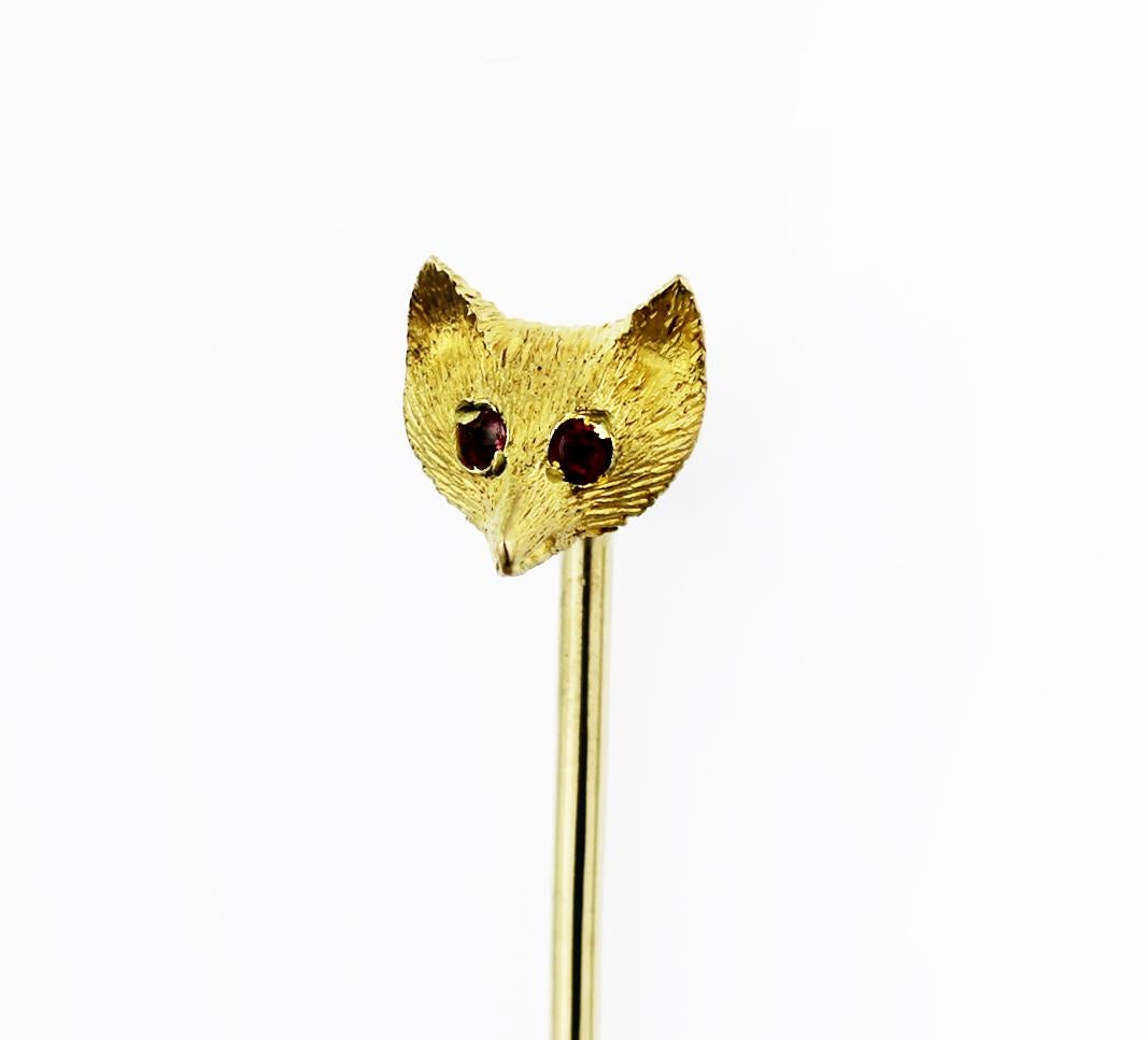 Sweet, edgy, and boho pin, creative and fun to wear, charming with this 9 caratyellow gold pin in fox head design. The fox head itself has incredible details, from its whiskers to its mysterious ruby eyes. The possibilities are endless, this