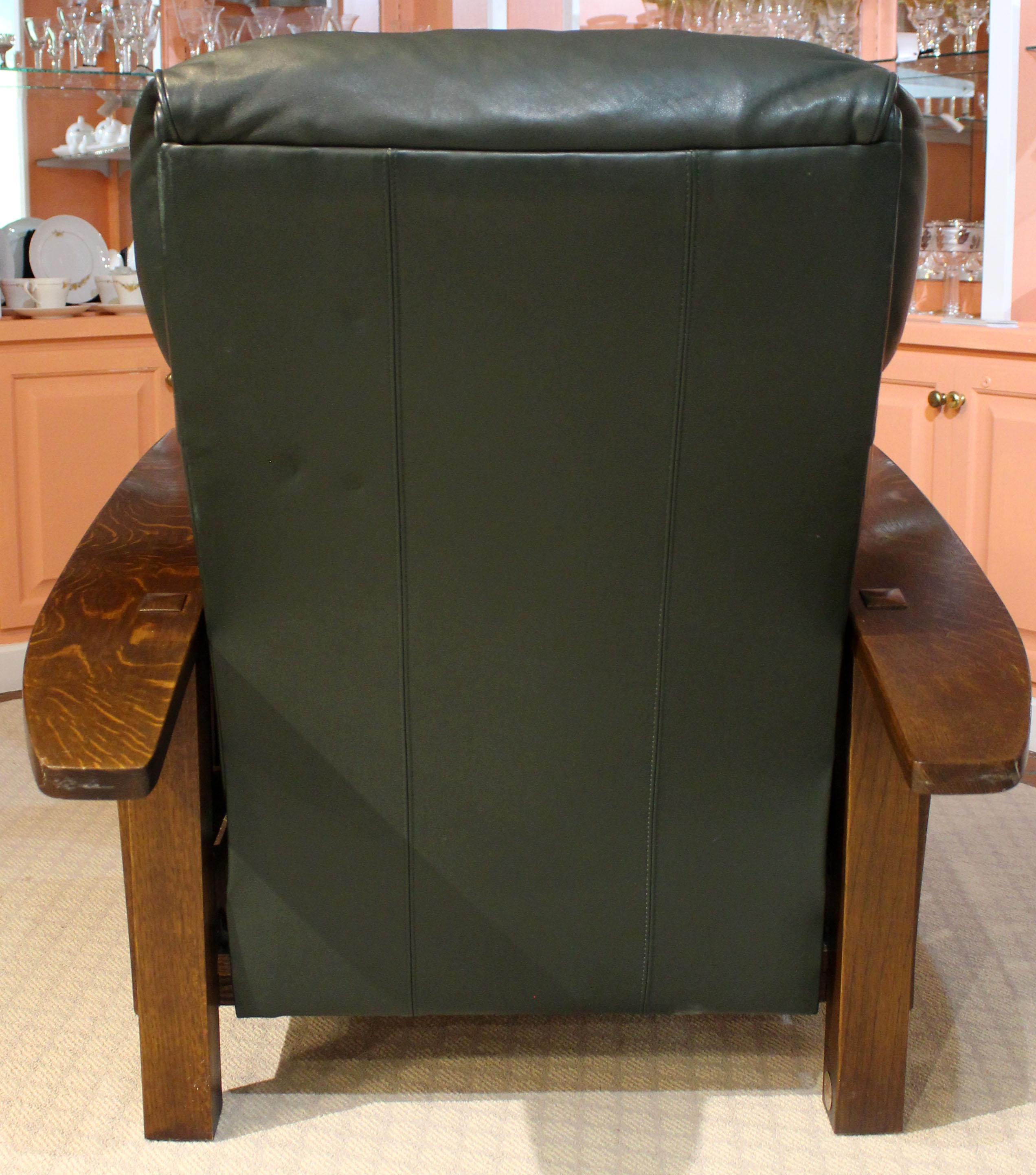 Vintage Stickley solid oak & blue-green leather reclining arm chair. This slatted sides with long, bowed arms design is a modern play on the historic Morris chairs. Superb craftmanship & the finest materials. Stickley label, Manlius, N.Y. and