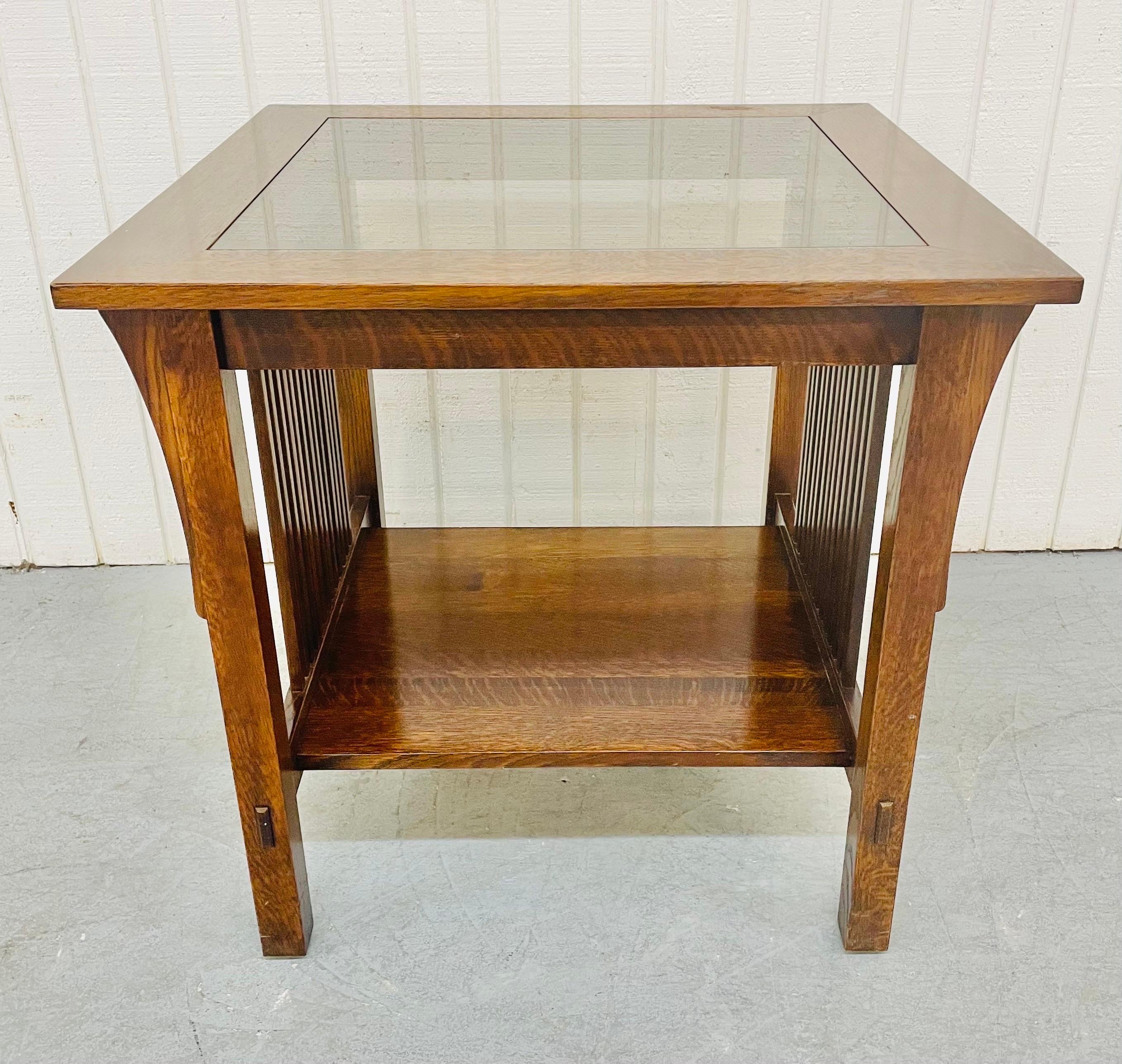 This listing is for a vintage Stickley Oak Mission Style Side Table. Featuring a square top with smoked glass insert, an open bottom space for storage, and beautiful oak finish.