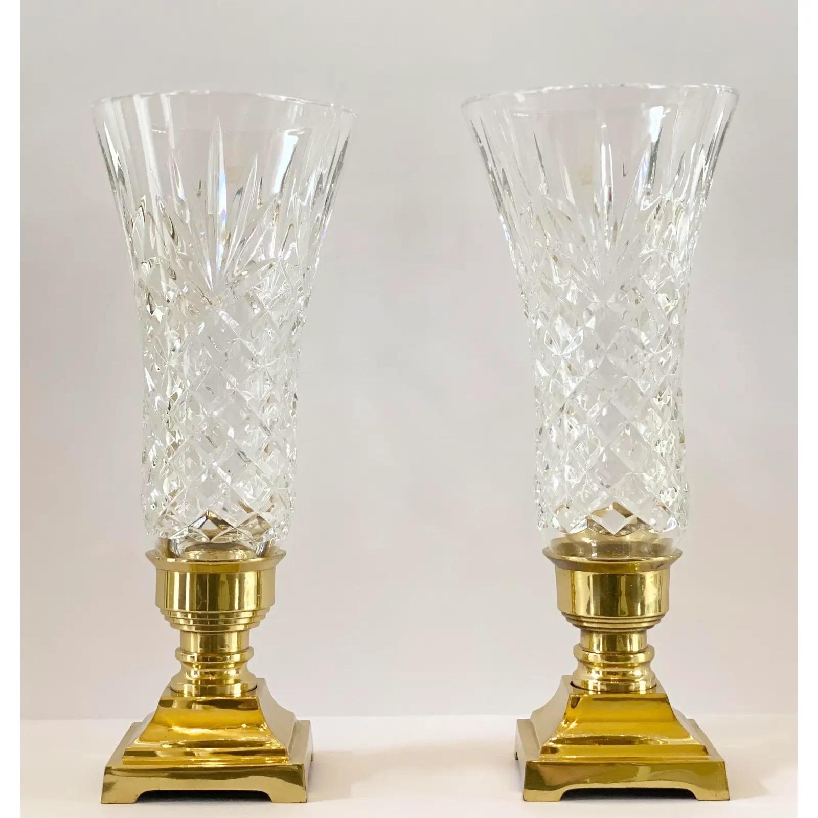 We are very pleased to offer a rare and sophisticated pair of candle holders by Stiffel, made in Poland, circa late 20th Century. This stunning pair showcases a brass square base with a crystal globe in a dazzling notched-rim diamond design. In