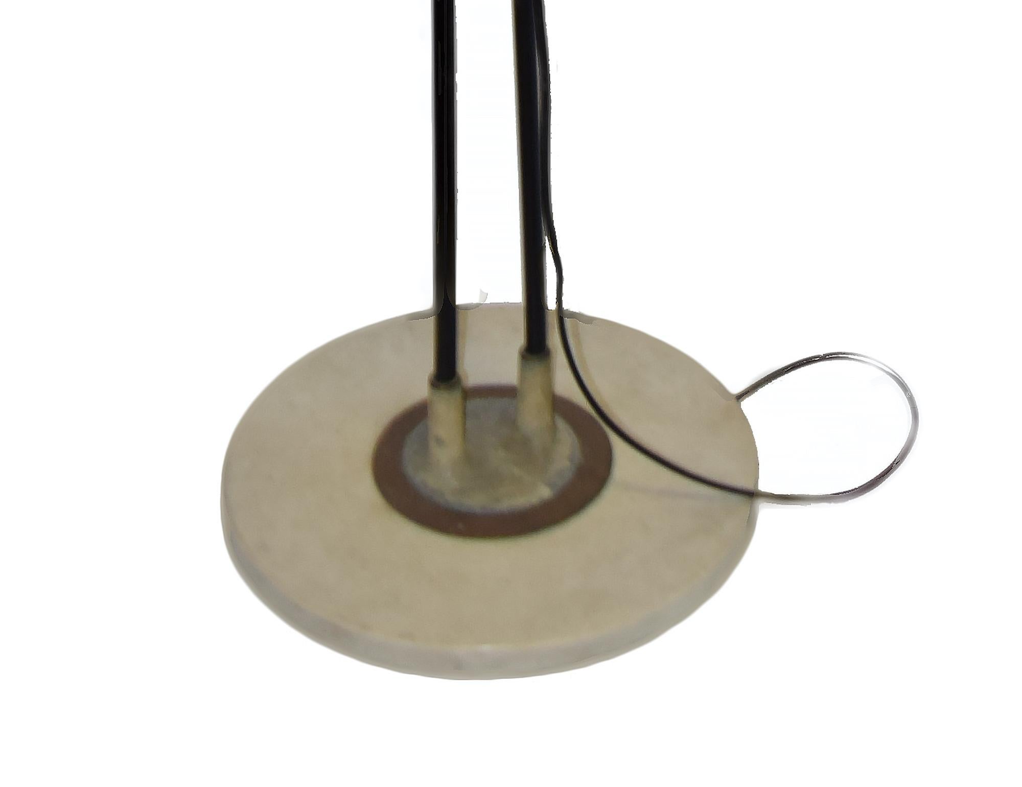 This vintage Stilnovo floor lamp is a design lamp manufactured by Stilnovo during the 1950s.

Floor lamp with a marble base, enameled brass structure, brass joints, enameled aluminum reflector, brass lampshade.

Dimensions: cm 34 (diameter) x