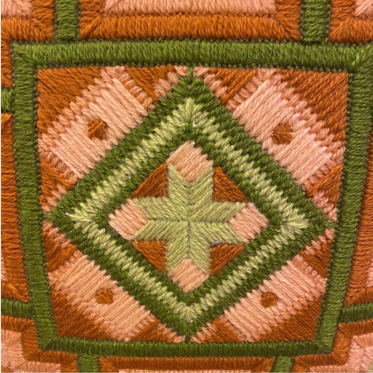 Oooh I love this one!   Various dashes of pinks and greens and umber on this handmade needlepoint/crewel work pillow.   The back is done in a lime green.