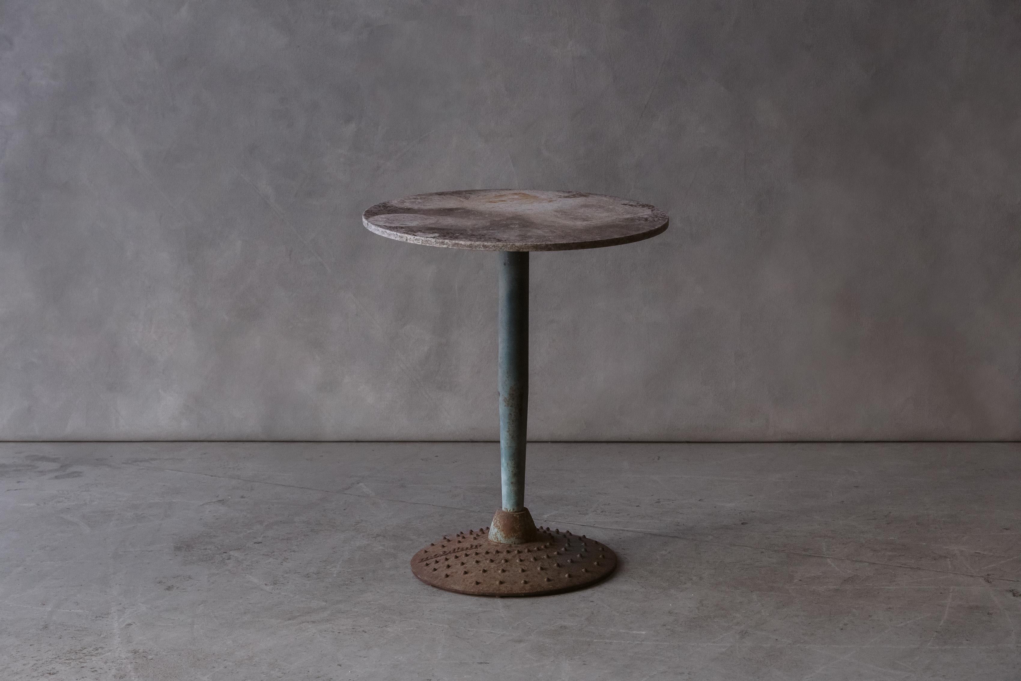 Vintage stone bistro table From France, circa 1960. Light grey stone top on a steel base. Nice original color and patina.

We prefer to speak directly with our clients. So, If you have any questions or would like to know more please give us a call