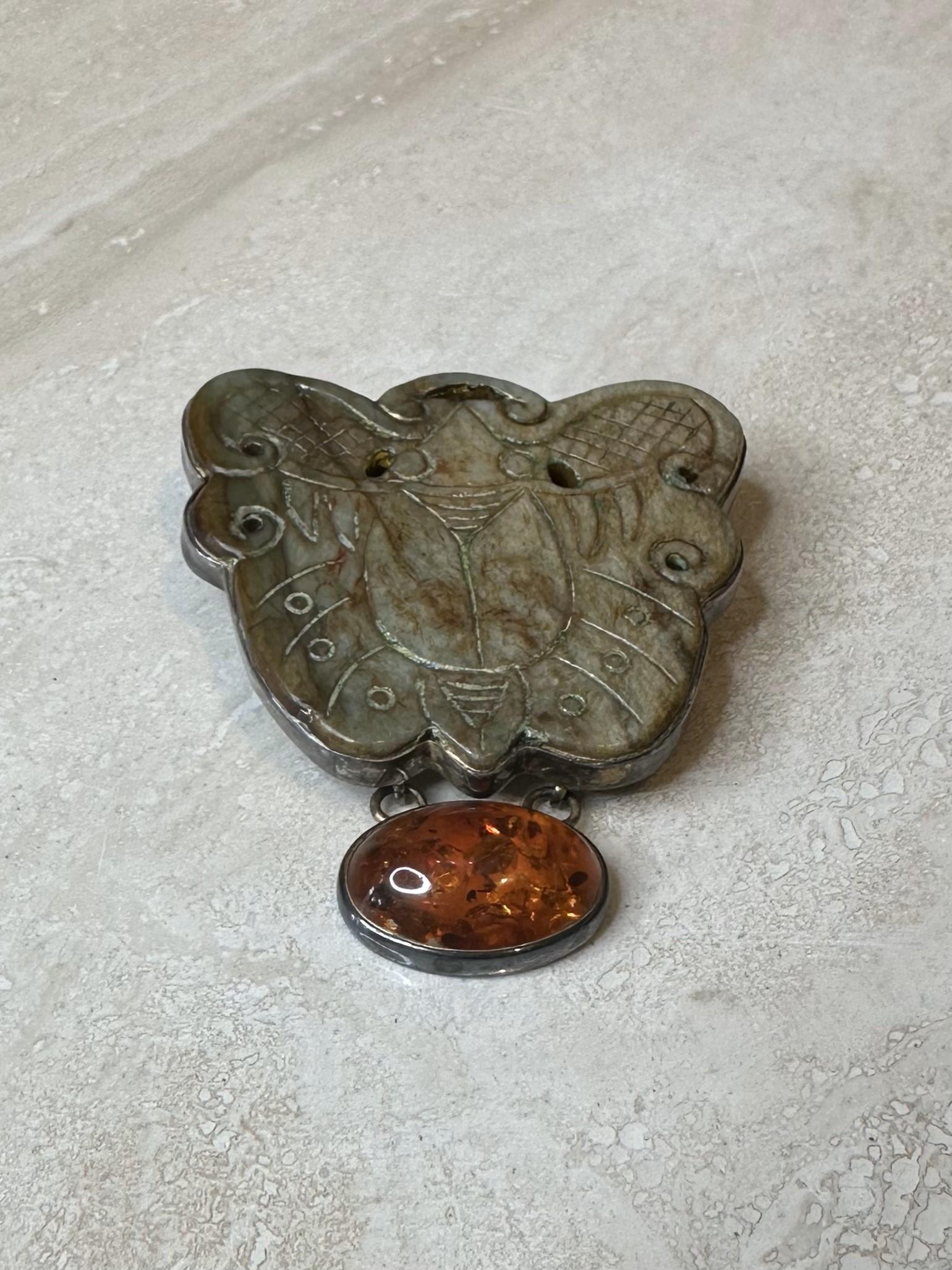 A vintage stone brooch with amber is a versatile and timeless accessory that adds character and warmth to any collection. Whether you're drawn to amber for its natural beauty, its organic inclusions, or its warm glow, a vintage amber brooch can make