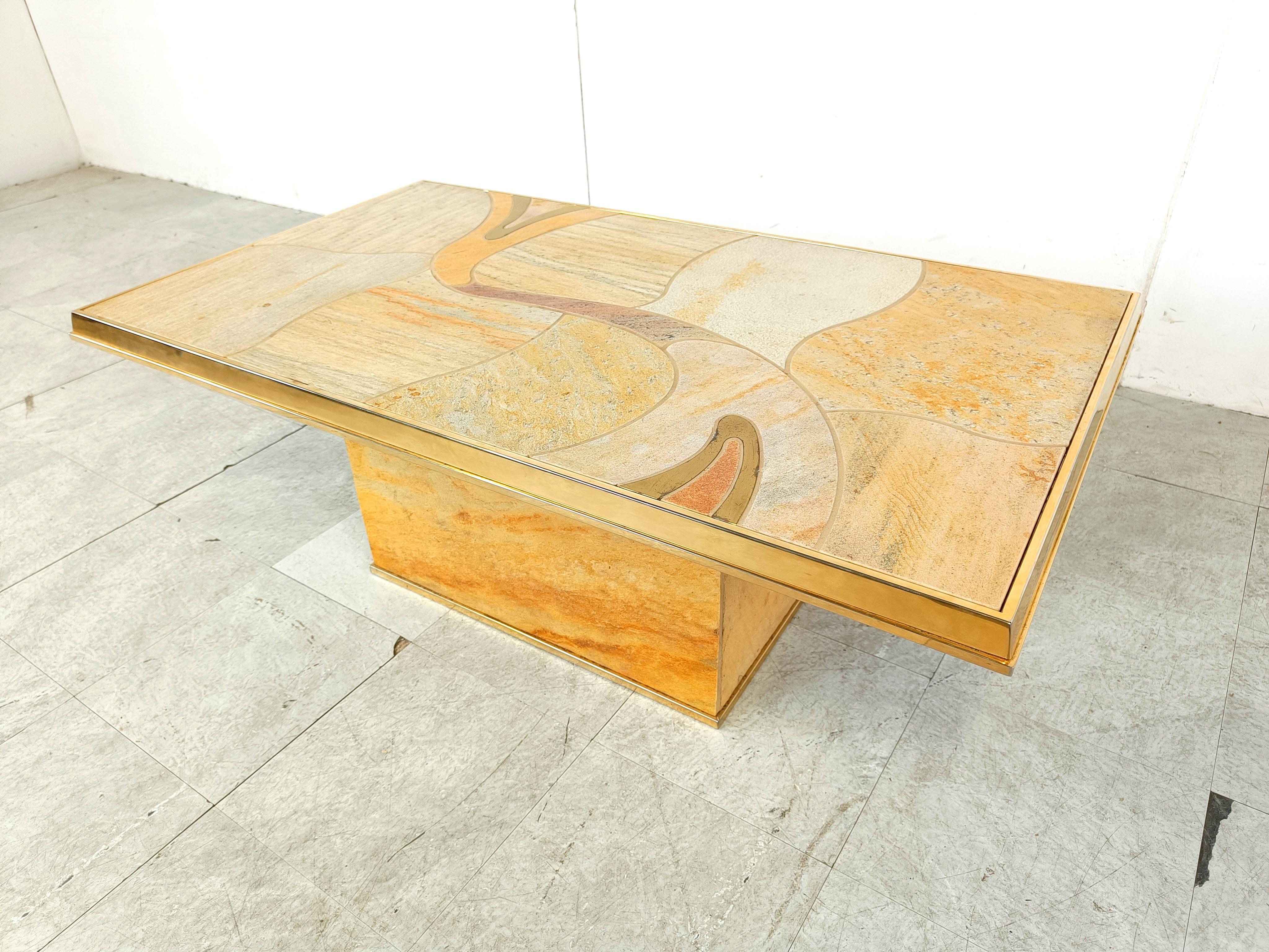 Striking rectangular coffee table by Fedam.

The beautiful natural stone colour scheme makes this coffee table unique. FInished with a brass etched and lebeled.

Fedam is a Belgian company.

1980s - Belgium

Dimensions
Height: 43cm/16.92
