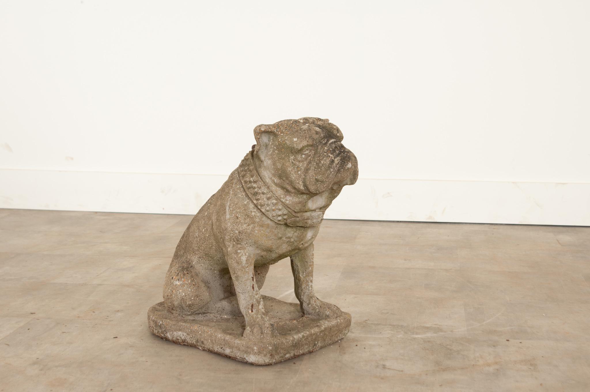 This vintage stone English bulldog is absolutely darling. Decades of outdoor exposure have given it a wonderful patina that brings out all the little details. We love his cute pointy ears, characteristic snout wrinkles, and studded collar. Make sure