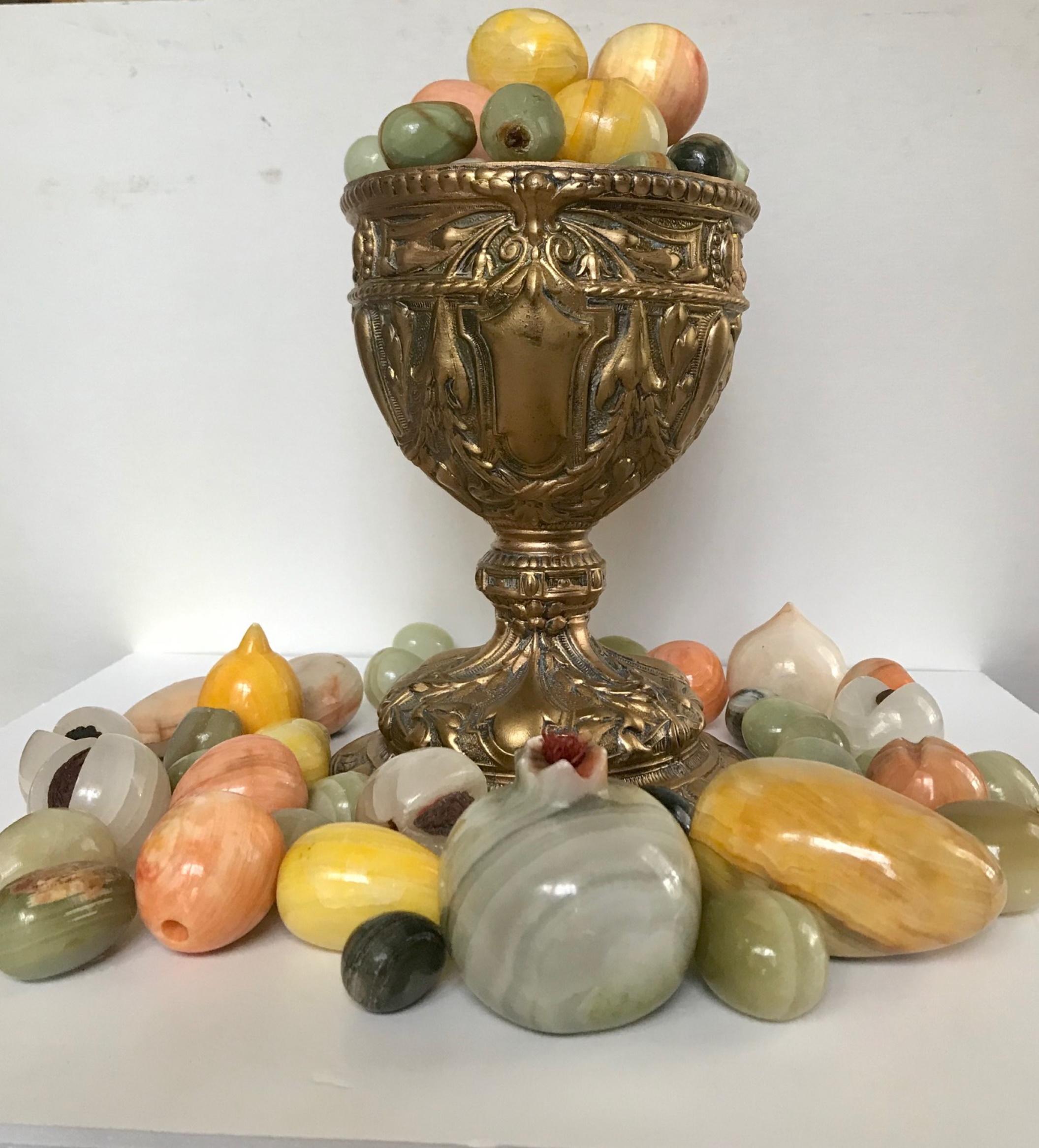 Vintage stone fruit, collection of 72, onyx, alabaster marble
This is a collection of 72 vintage onyx, marble and alabaster fruit which comes with a 19th century gilt metal goblet. A beautiful décor compliment or centerpiece.

The vintage fruit