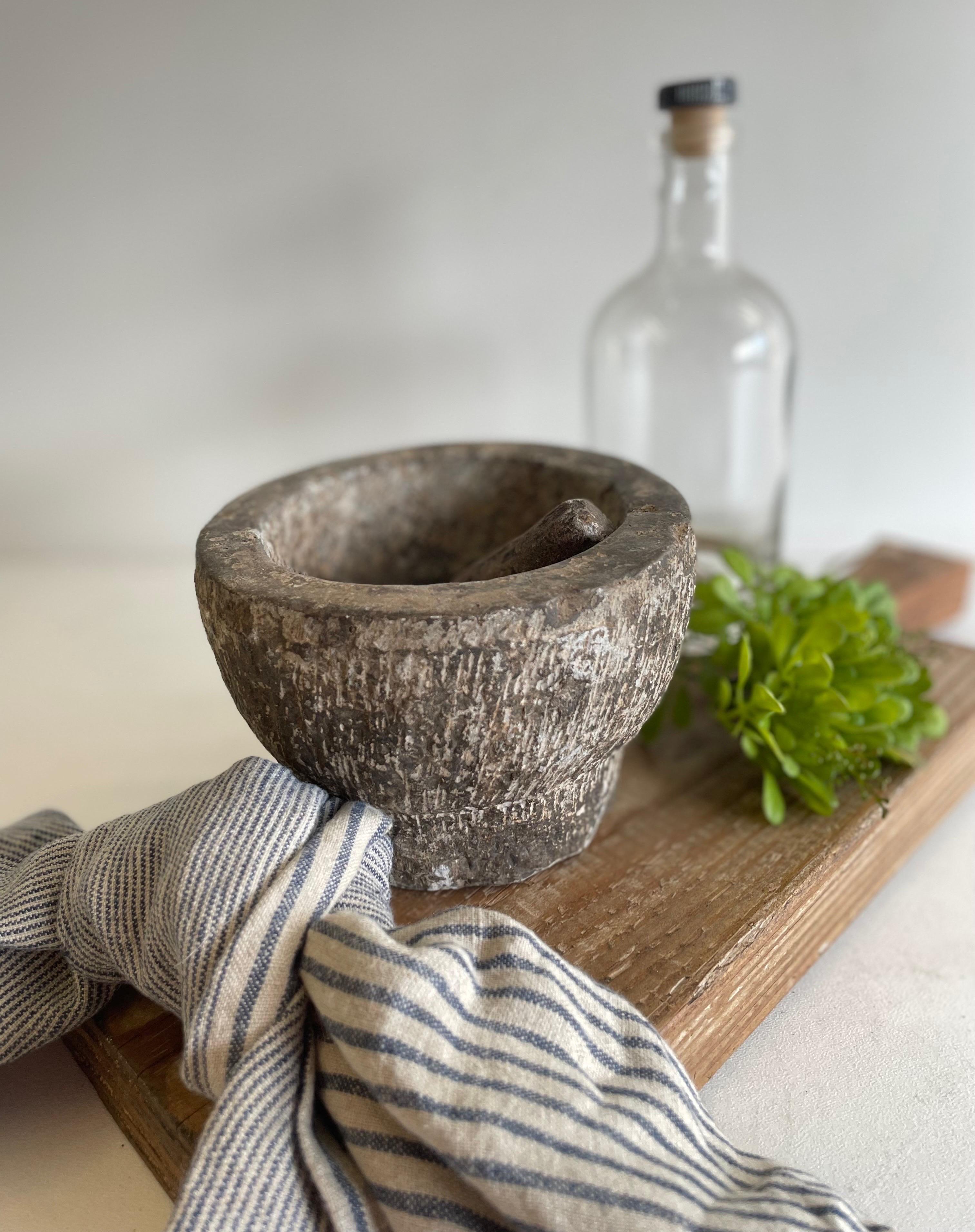Antique stone mortar and pestle bowl set, great decorative item, or can be used. Accessories not included 
Size: 6 1/2” D x 4 1/2” H.