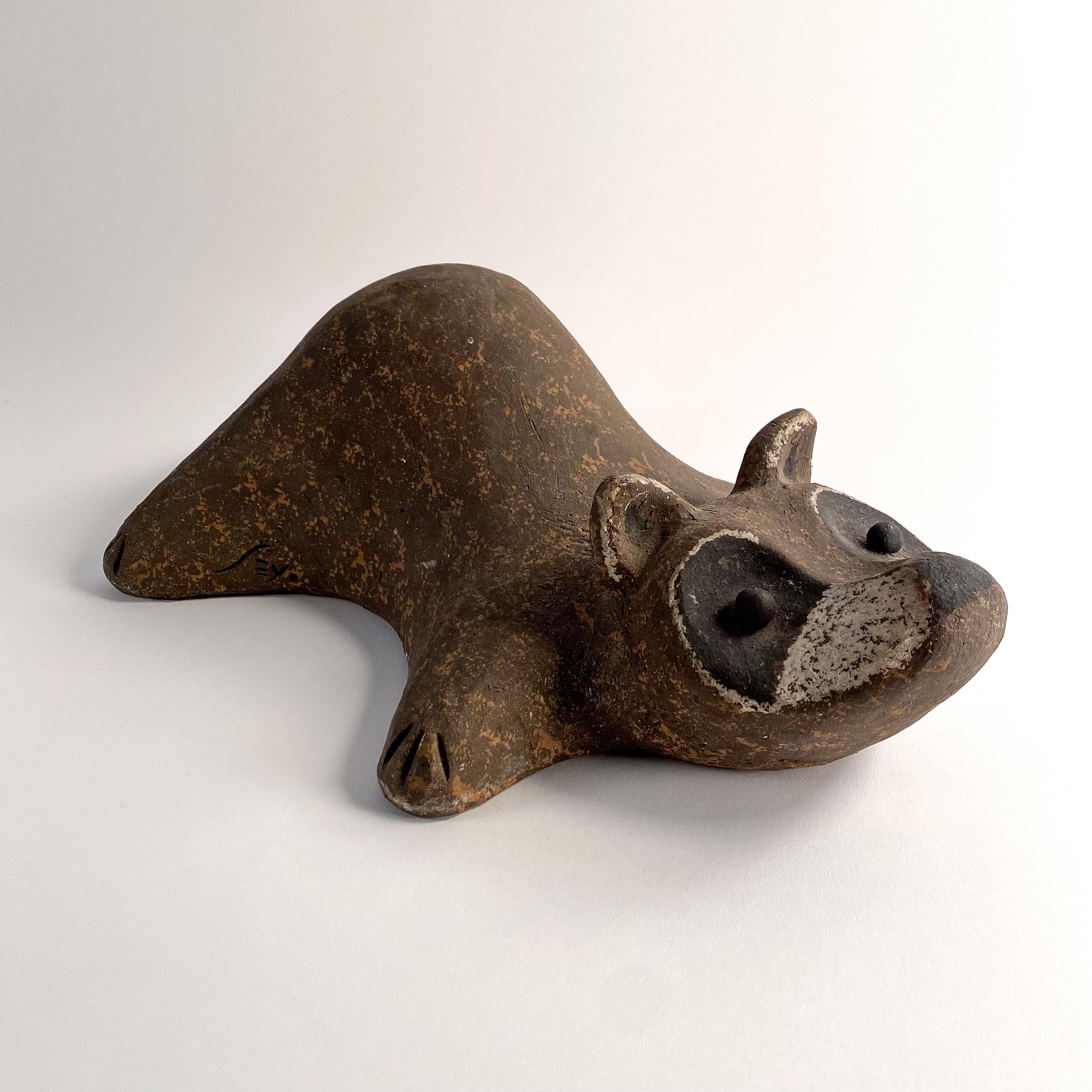 Awesome ceramic racoon sculpture by John H Seymour.  signed.