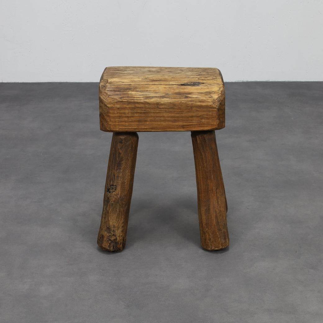 This heavy, rustic stool captures the spirit of brutalist design with a distinct Folkart character: raw, honest, and rooted in traditional craftsmanship. The thick seat and strongly proportioned legs give it a sculptural presence.

Visible wood