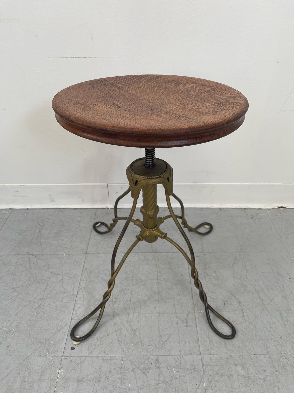 Mid-Century Modern Vintage Stool With Adjustable Wooden Seat and Wrought Iron Base. For Sale