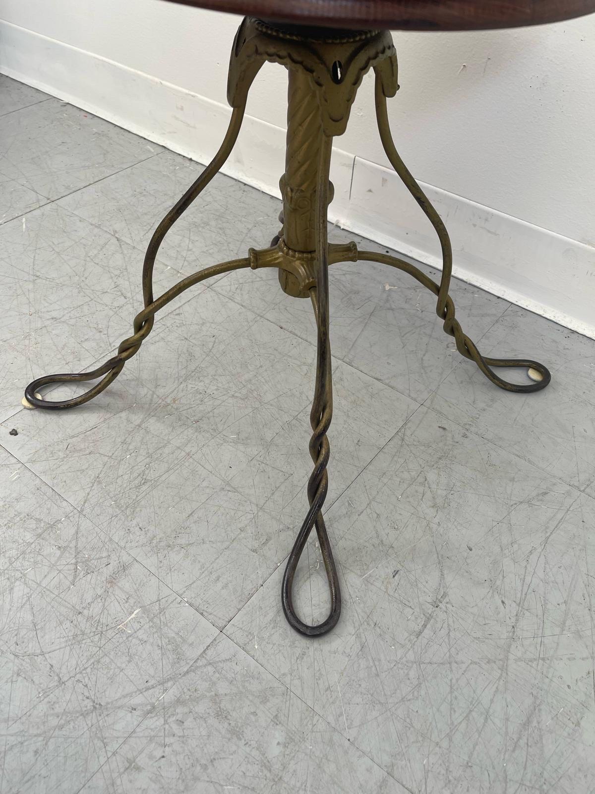 Late 20th Century Vintage Stool With Adjustable Wooden Seat and Wrought Iron Base. For Sale